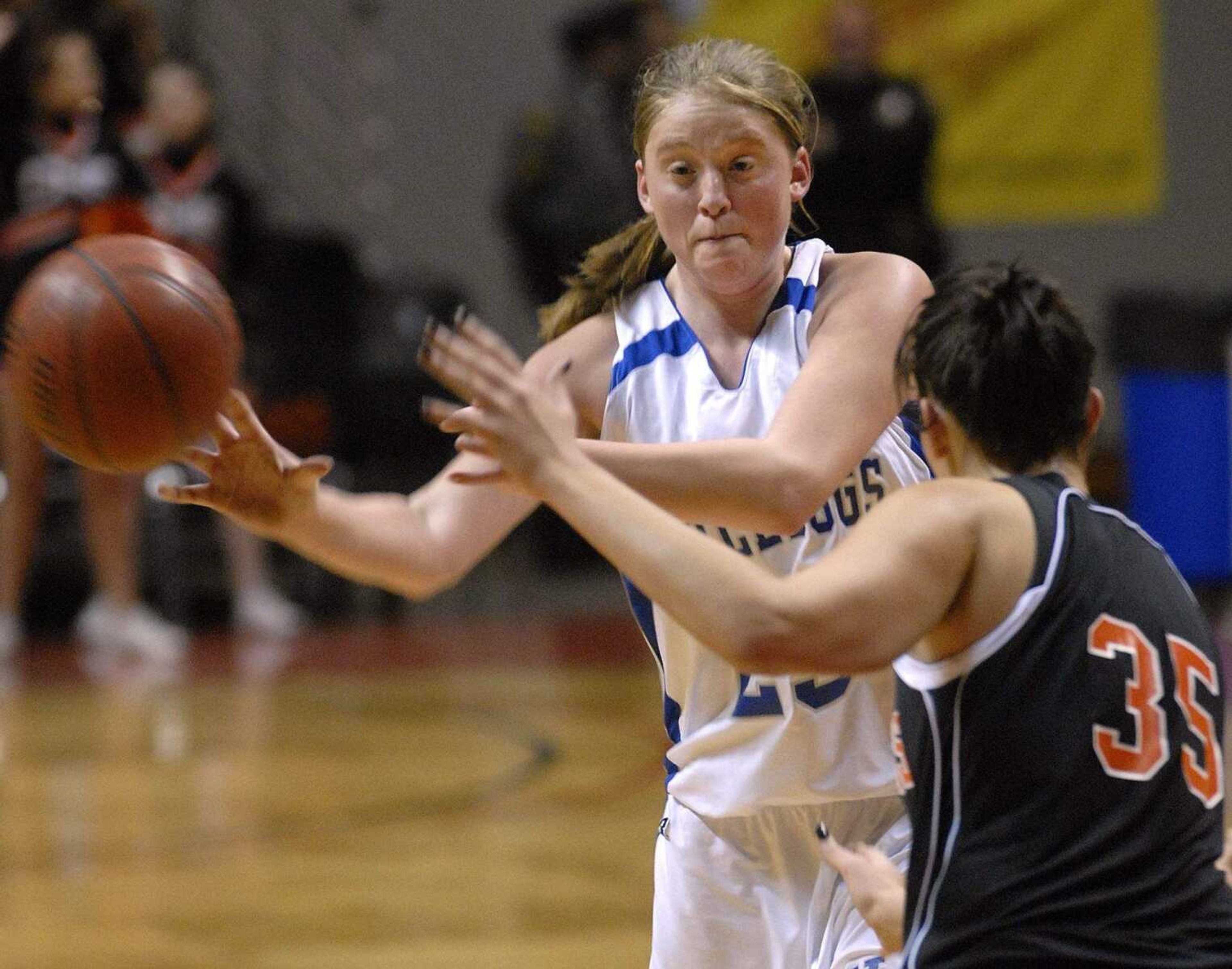 FRED LYNCH ~ flynch@semissourian.com
Notre Dame's Jane Morrill passes the ball away from Central's Wendi Zickfield in the fourth quarter Monday at the Show Me Center.