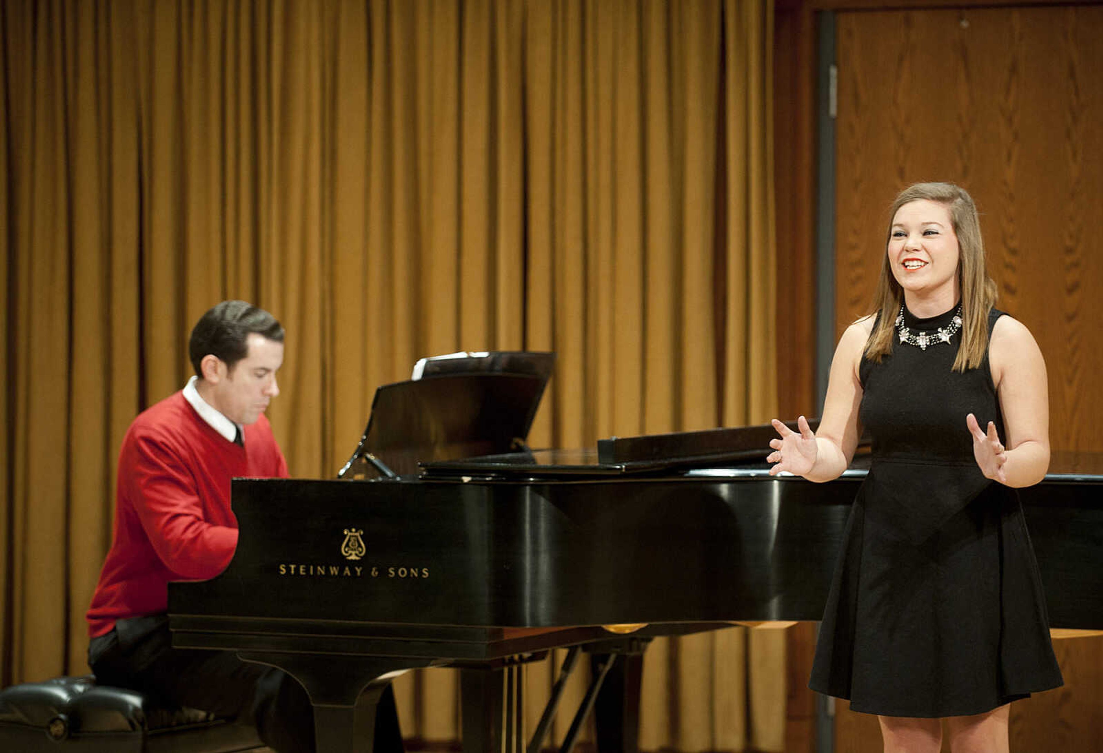 Southeast Missouri State University student Anna Hebrank, right, is accompanied on piano by musical theatre instructor Joe Mason as she sings "Disneyland" from the musical "Smile," during the Class Voice III Recital Sunday, Dec. 15, at the Shuck Recital Hall. Fifteen Southeast students performed during the annual recital which is in its sixth year.