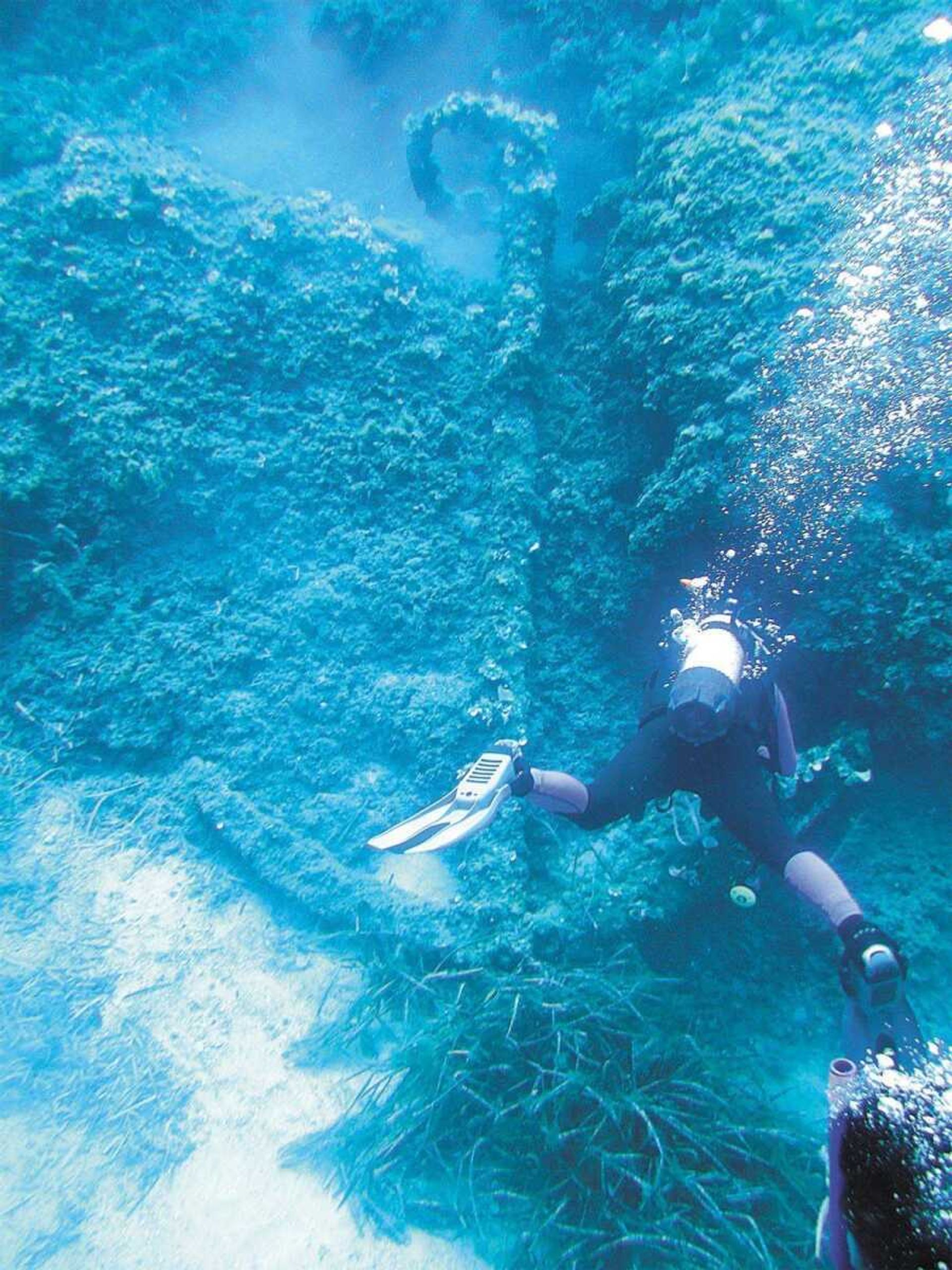 Jennifer Rickard swims next to a ship's anchor several times her size off the coast of the island of Menorca. (Jennifer Rickard ~ Submitted image)