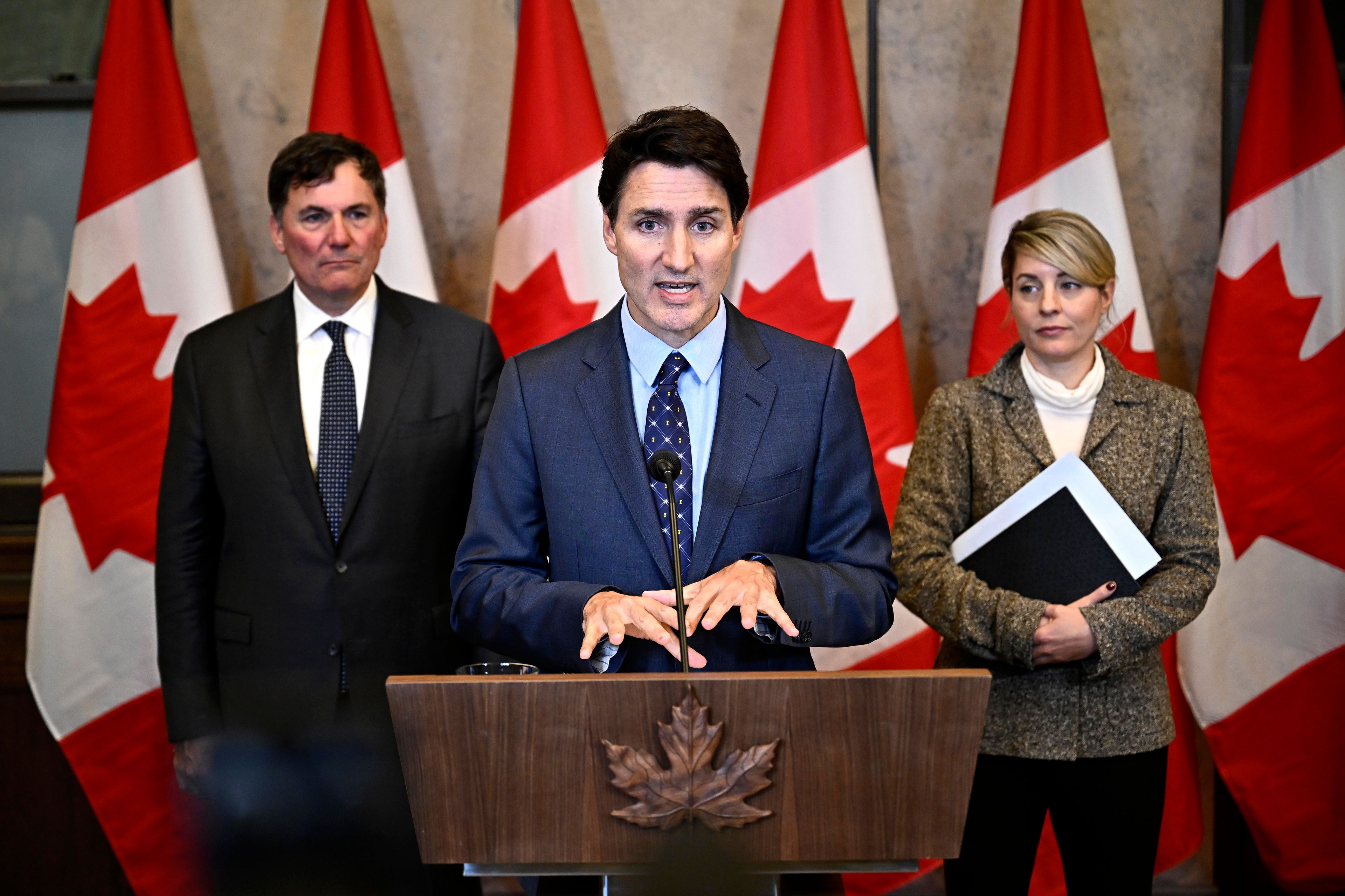 Canadian Prime Minister Justin Trudeau, centre, Minister of Public Safety, Democratic Institutions and Intergovernmental Affairs Dominic LeBlanc, left, and Minister of Foreign Affairs Melanie Joly participate in a news conference on the investigative efforts related to violent criminal activity occurring in Canada with connections to India, on Parliament Hill in Ottawa, Ontario, Monday, Oct. 14, 2024. (Justin Tang/The Canadian Press via AP)