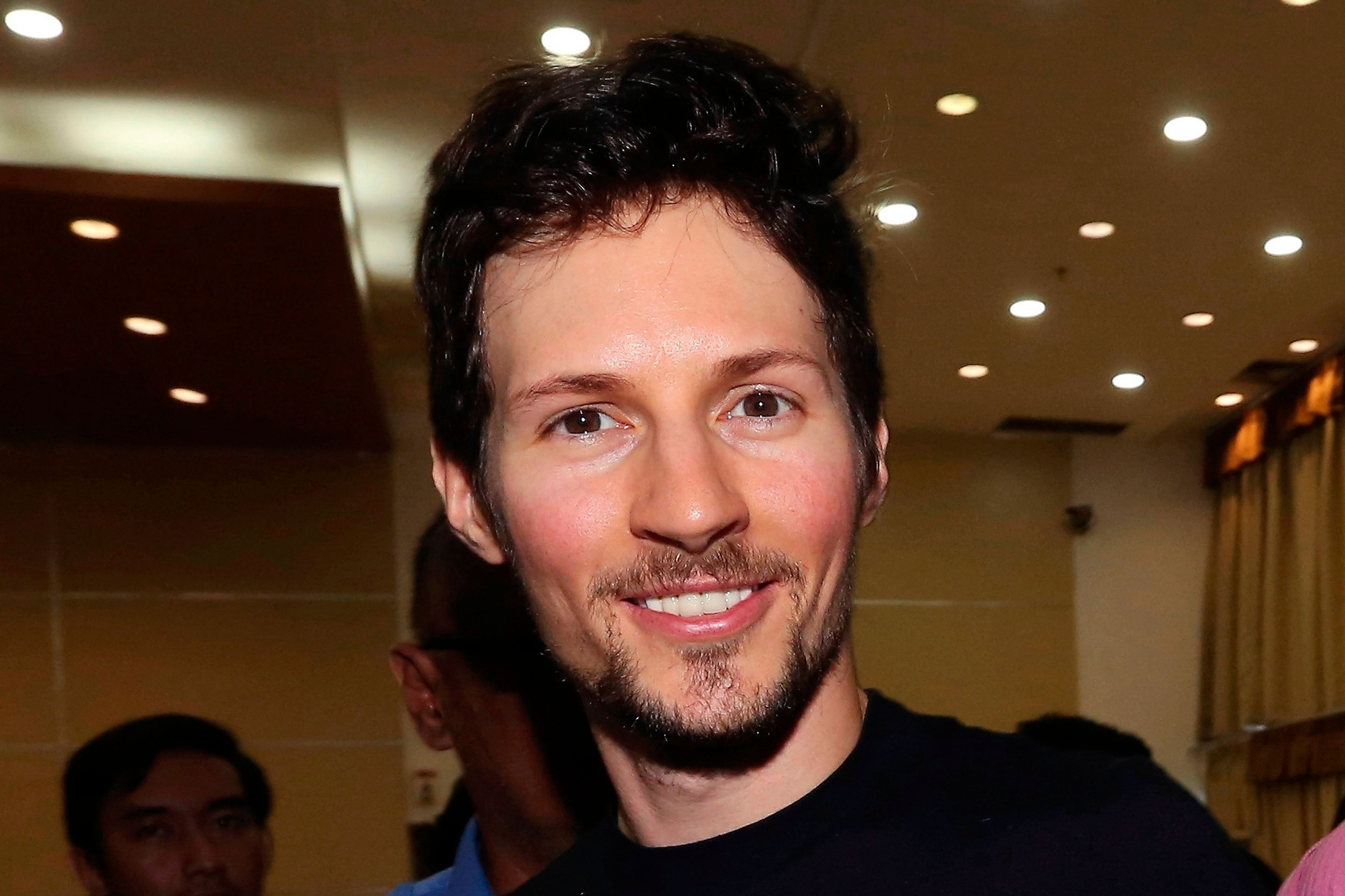 FILE - Telegram co-founder Pavel Durov, center, smiles following his meeting with Indonesian Communication and Information Minister Rudiantara in Jakarta, Indonesia on Aug. 1, 2017. (AP Photo/Tatan Syuflana, File)