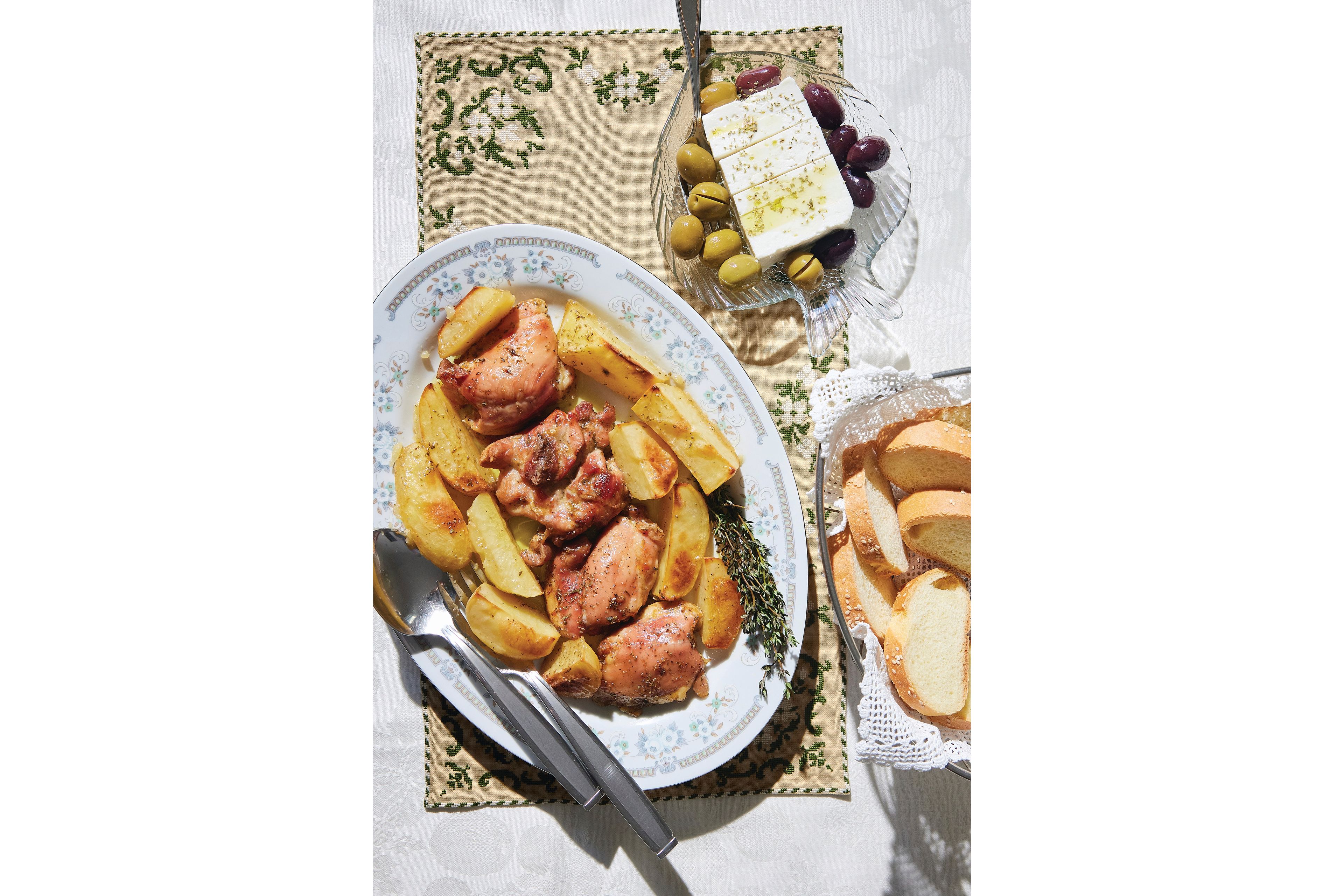 This image released by Harvest shows a recipe for Greek chicken from "The League of Kitchens Cookbook: Brilliant Tips, Secret Methods & Favorite Family Recipes from Around the World" by Lisa Kyung Gross. (Kristin Teig/Harvest via AP)