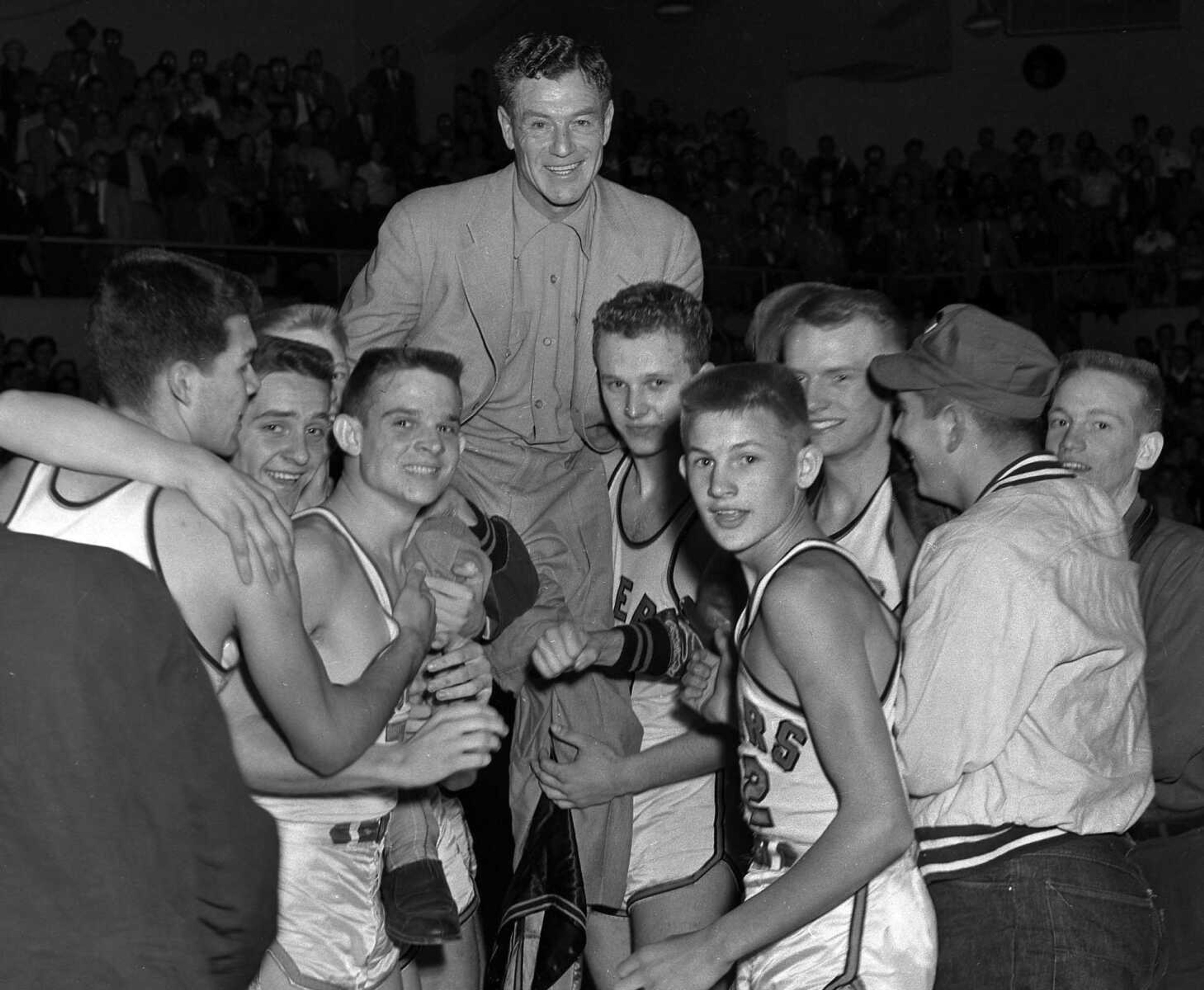 Central coach Lou Muegge was lifted on the shoulders of his players, after they won the 1954 state high school basketball championship. The game was played at Houck Field House on March 6, 1954. The Tigers defeated the Christian Brothers Cadets of St. Louis 79-55. Lou Muegge died July 14, 1955 at a hospital in St. Louis where he had gone for a physical examination a week earlier. He was 51. He had suffered a heart attack five months earlier while playing golf at the Country Club.