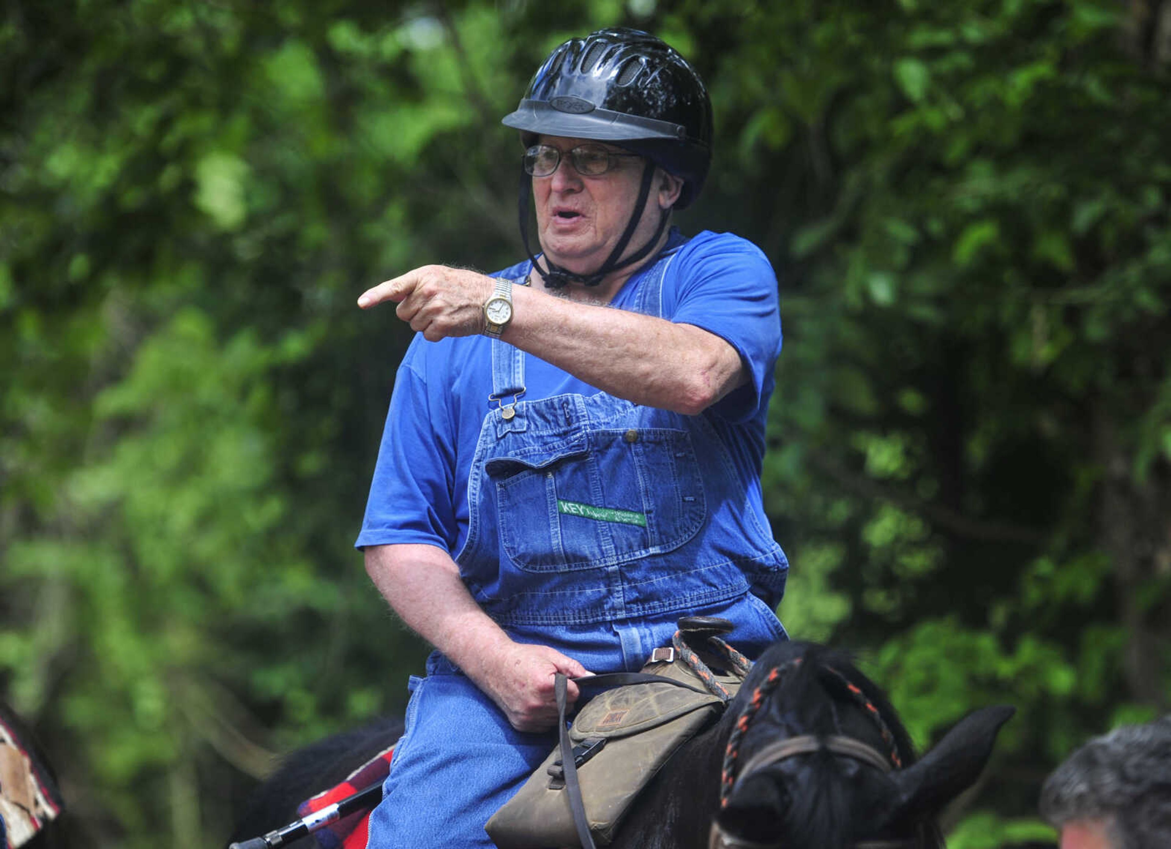 Dick Seabaugh talks with other horsemen during a trail ride sponsored by Jackson Trail Riders June 4, 2017, in Patton, Missouri.