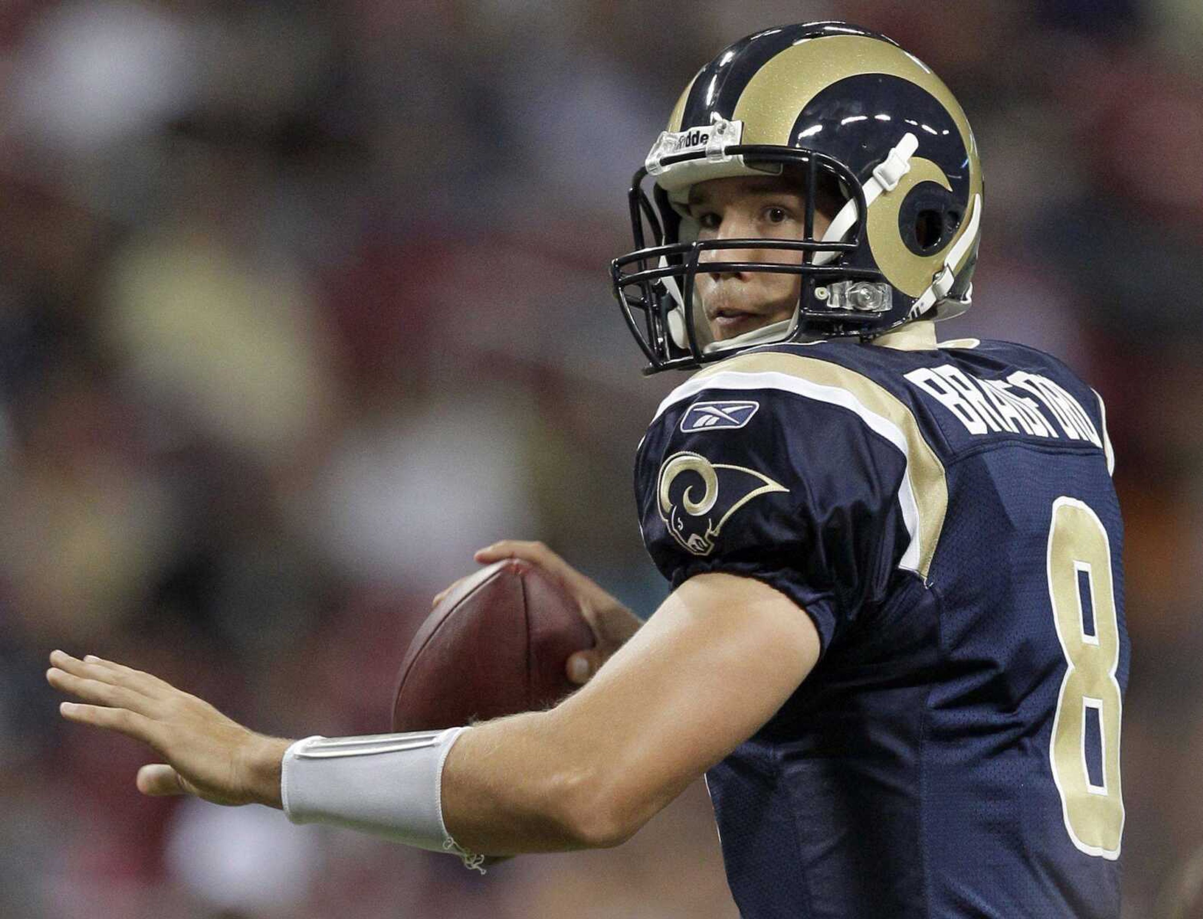 Rams quarterback Sam Bradford will be the first rookie to start at quarterback for the franchise since 1964. (JEFF ROBERSON ~ Associated Press)