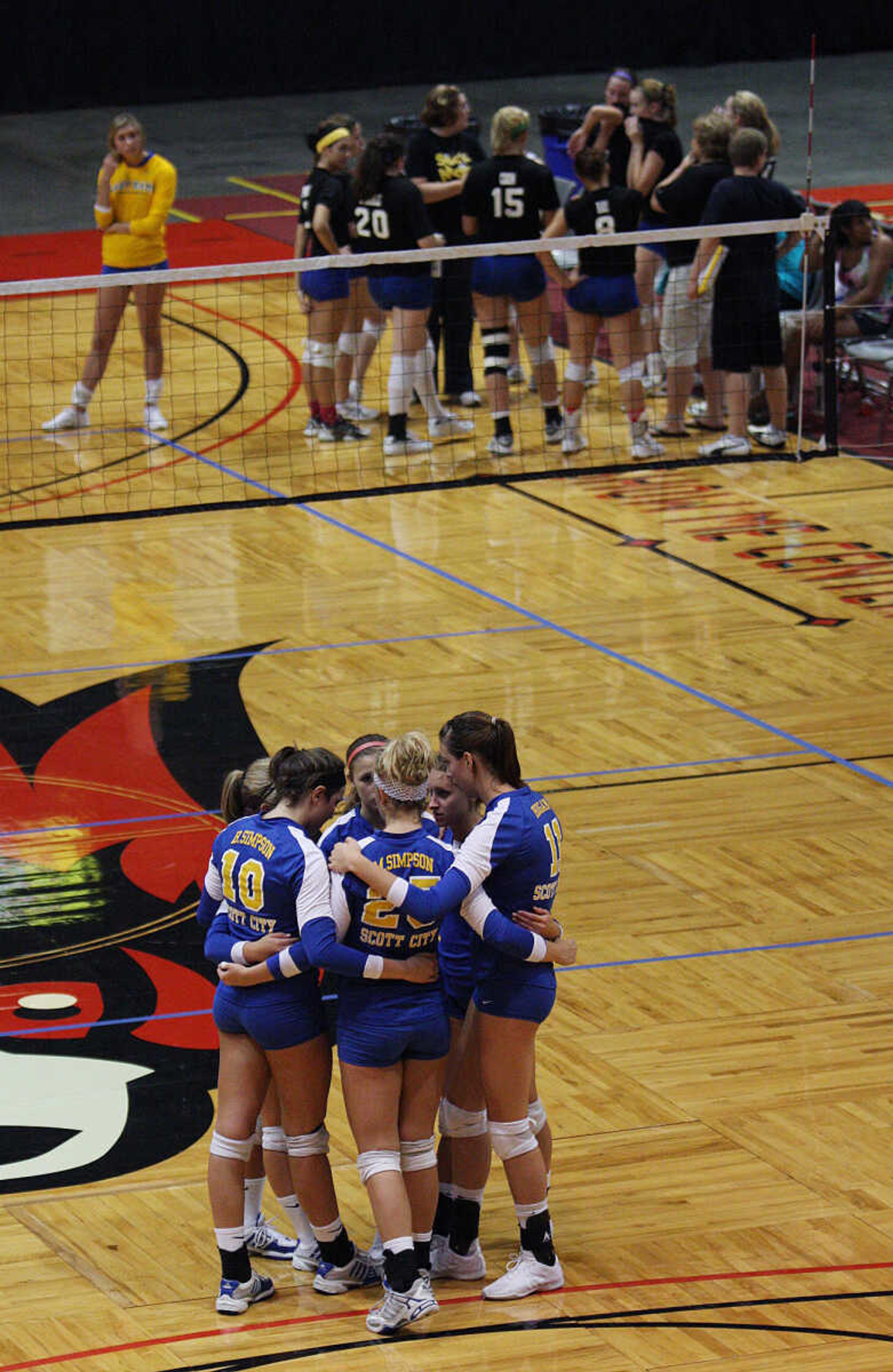 Scott City, foreground, and Seckman huddle up during a break.