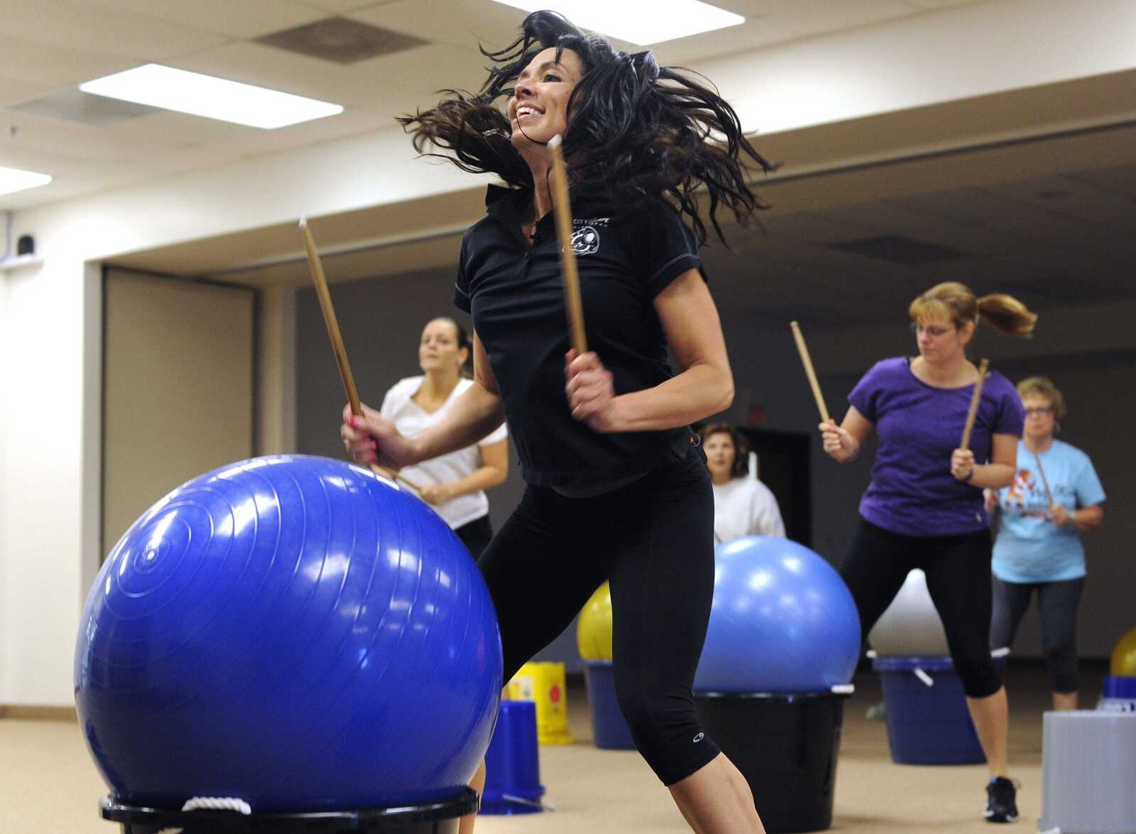 Tamatha Crowson leads a cardio drumming class Tuesday, June 7, 2016 at the Osage Centre.