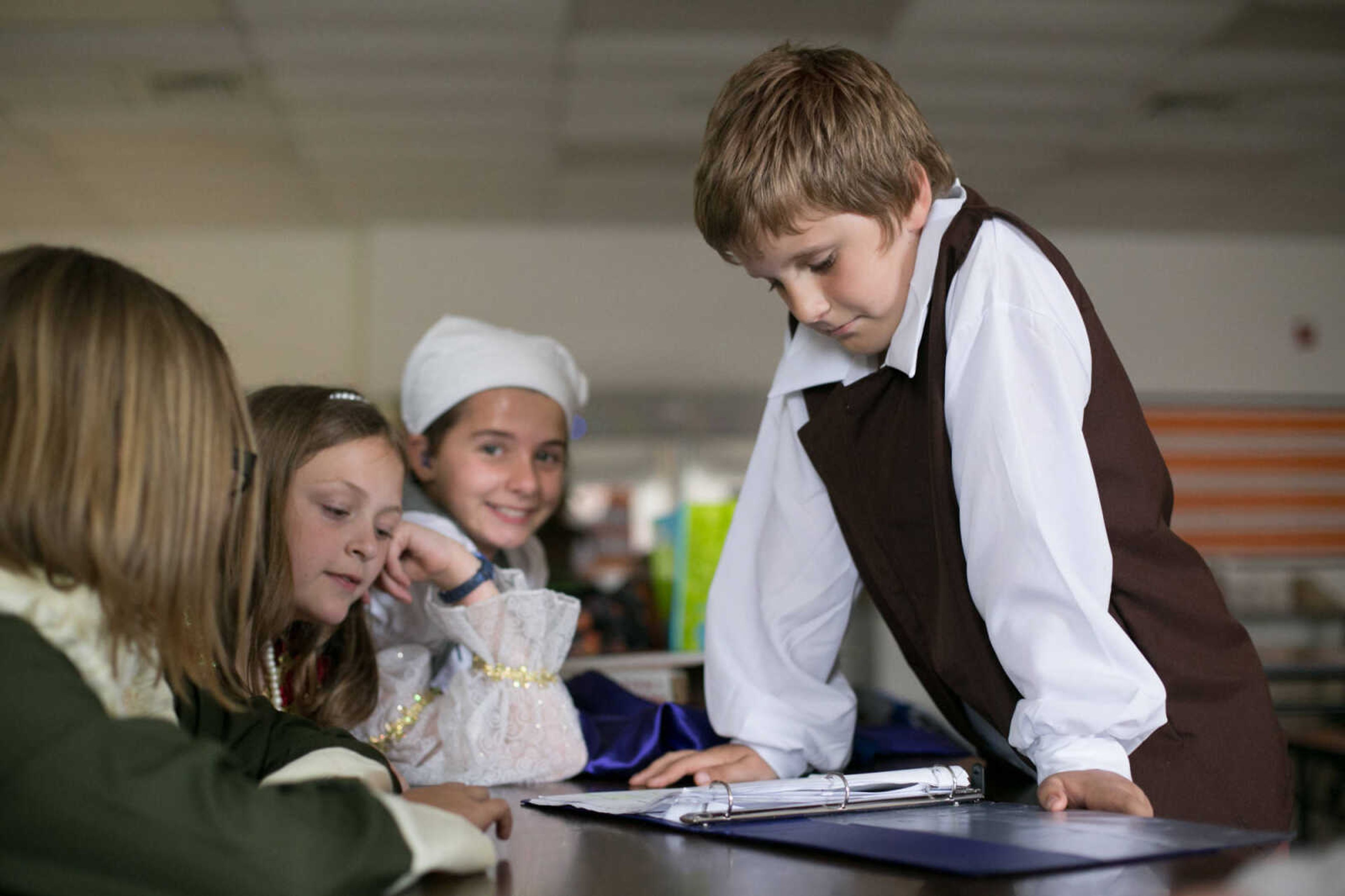 GLENN LANDBERG ~ glandberg@semissourian.com

Noah Armstrong and a few cast mates review their lines during a dress rehearsal of "The Princess and the Pea" Tuesday, May 10, 2016 at Alma Schrader Elementary School in Cape Girardeau.