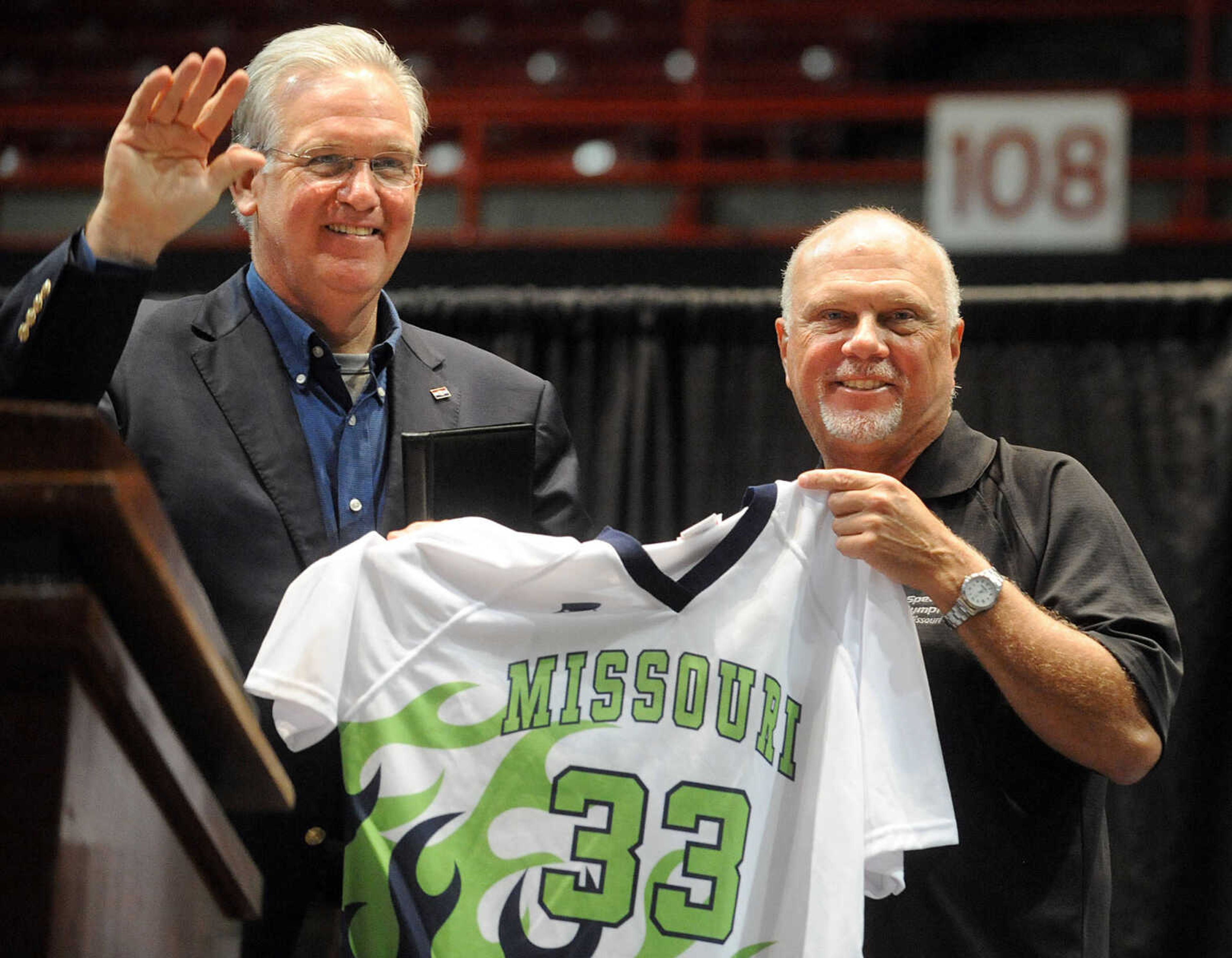 LAURA SIMON ~ lsimon@semissourian.com

Special Olympics Missouri President and CEO Mark Musso, right, presents Missouri Gov. Jay Nixon with an honorary jersey, Friday, Oct. 11, 2013 during the opening ceremony for the Special Olympics Missouri State Fall Games at the Show Me Center.