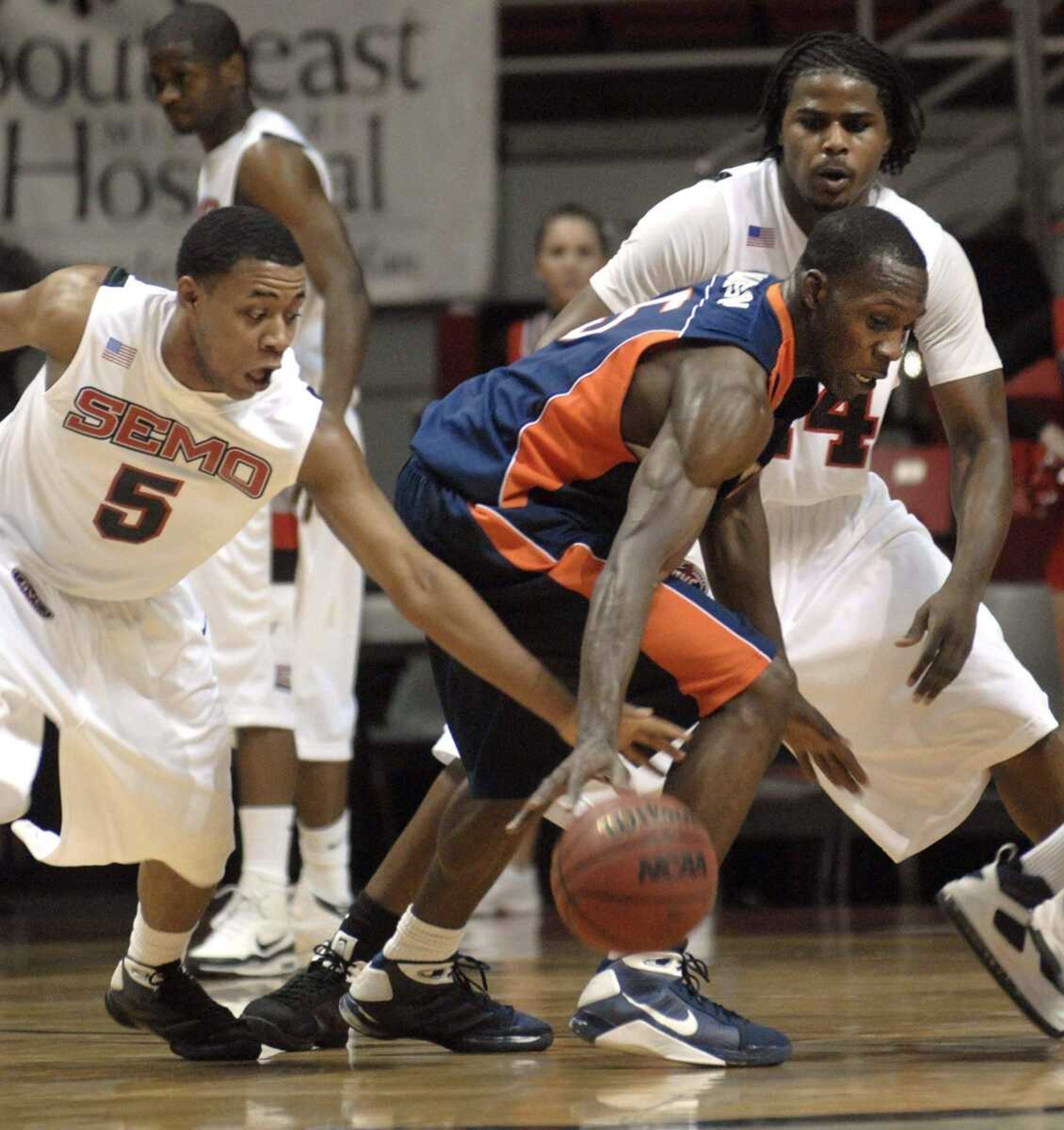 FRED LYNCH ~ flynch@semissourian.comTennessee-Martin's Lester Hudson nearly loses the ball to Southeast Missouri State's Bijon Jones, left, as Southeast's Johnny Hill also defends during the second half Monday at the Show Me Center.