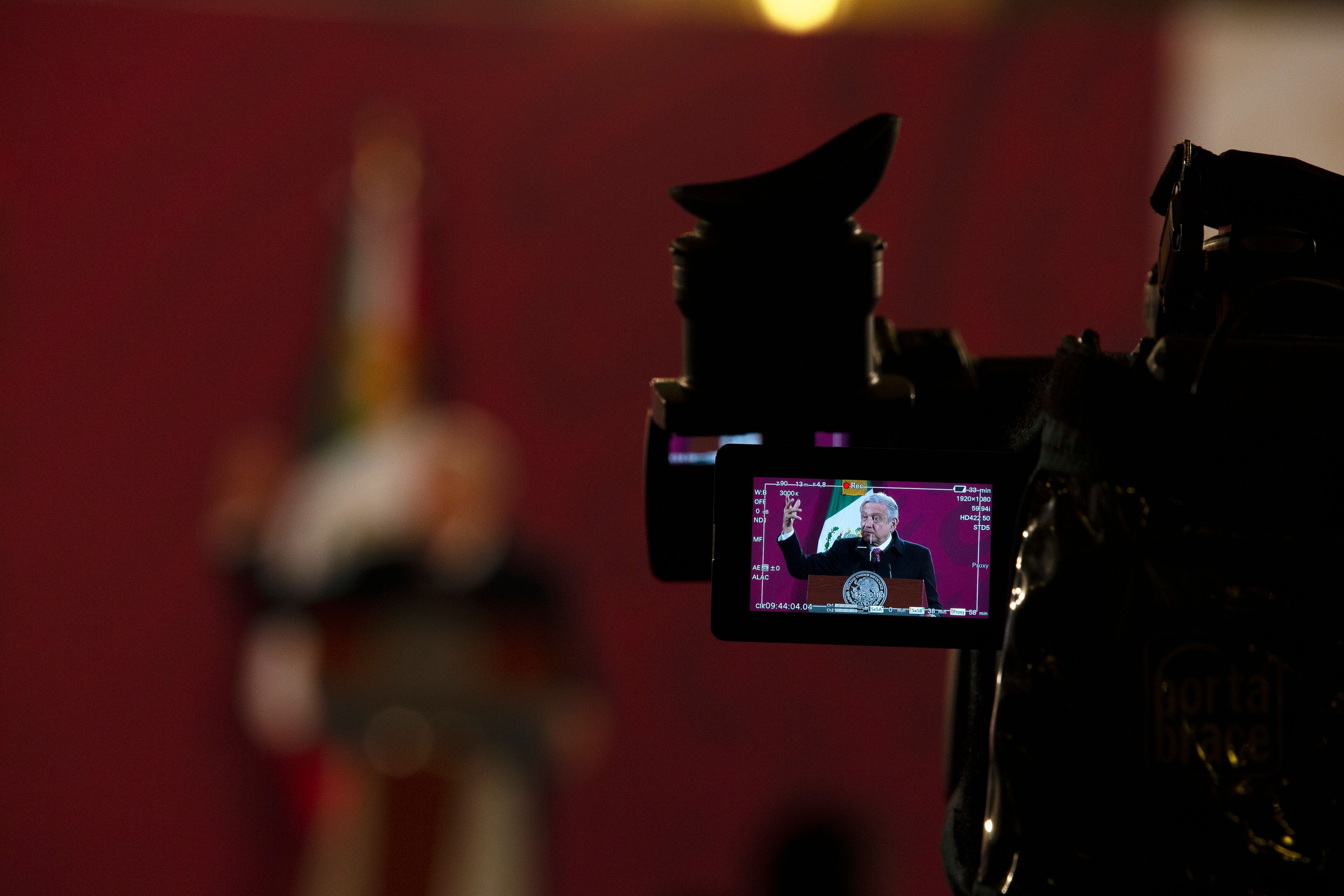 FILE - Mexican President Andres Manuel Lopez Obrador is seen on a camera screen as he gives his daily, morning news conference at the presidential palace in Mexico City, Dec. 18, 2020. (AP Photo/Marco Ugarte, File)