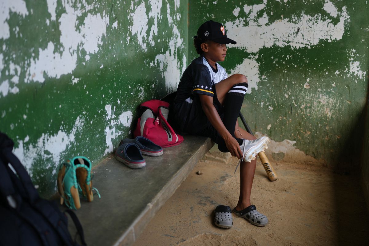 A 12-year-old baseball standout trains through tears after Venezuela quakes leave him homeless