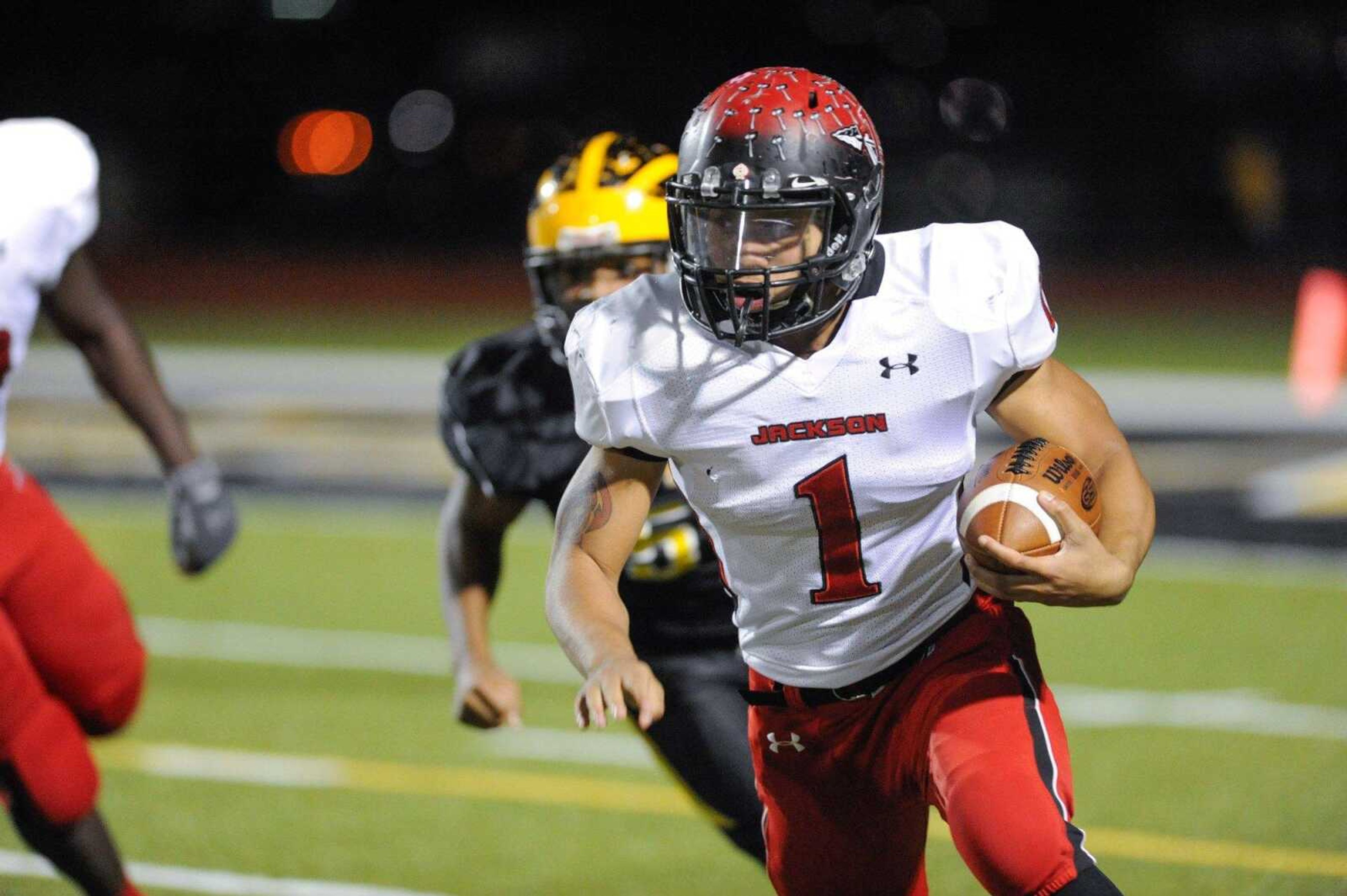 Jackson's Bryndan Reid carries the ball during the first quarter against Vianney in a Class 5 District 1 game Friday, Oct. 24, 2015 at St. John Vianney High School in St. Louis, Missouri.