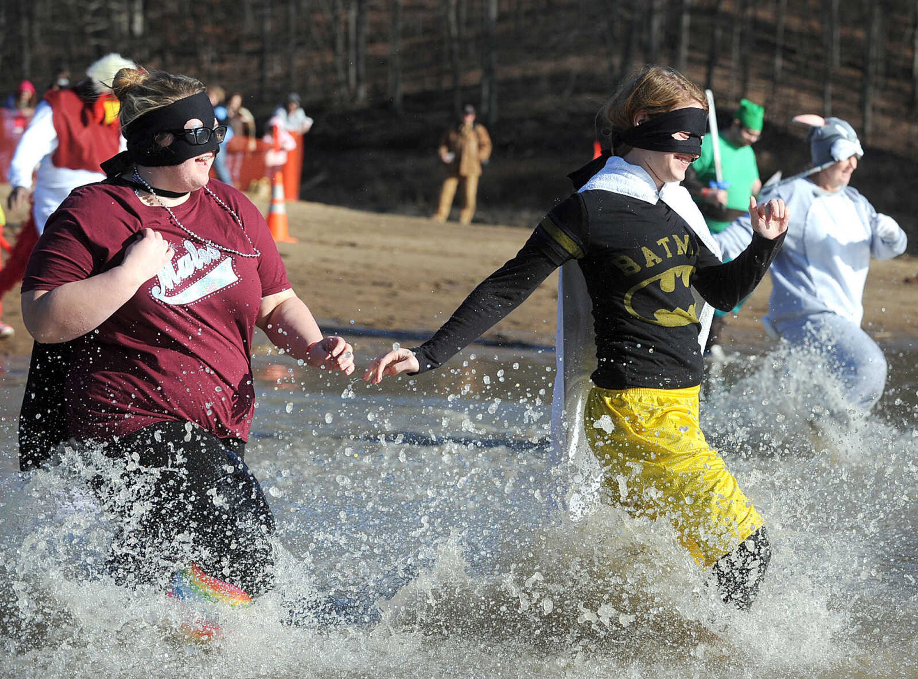 LAURA SIMON ~ lsimon@semissourian.com
People plunge into the cold waters of Lake Boutin Saturday afternoon, Feb. 2, 2013 during the Polar Plunge at Trail of Tears State Park. Thirty-six teams totaling 291 people took the annual plunge that benefits Special Olympics Missouri.