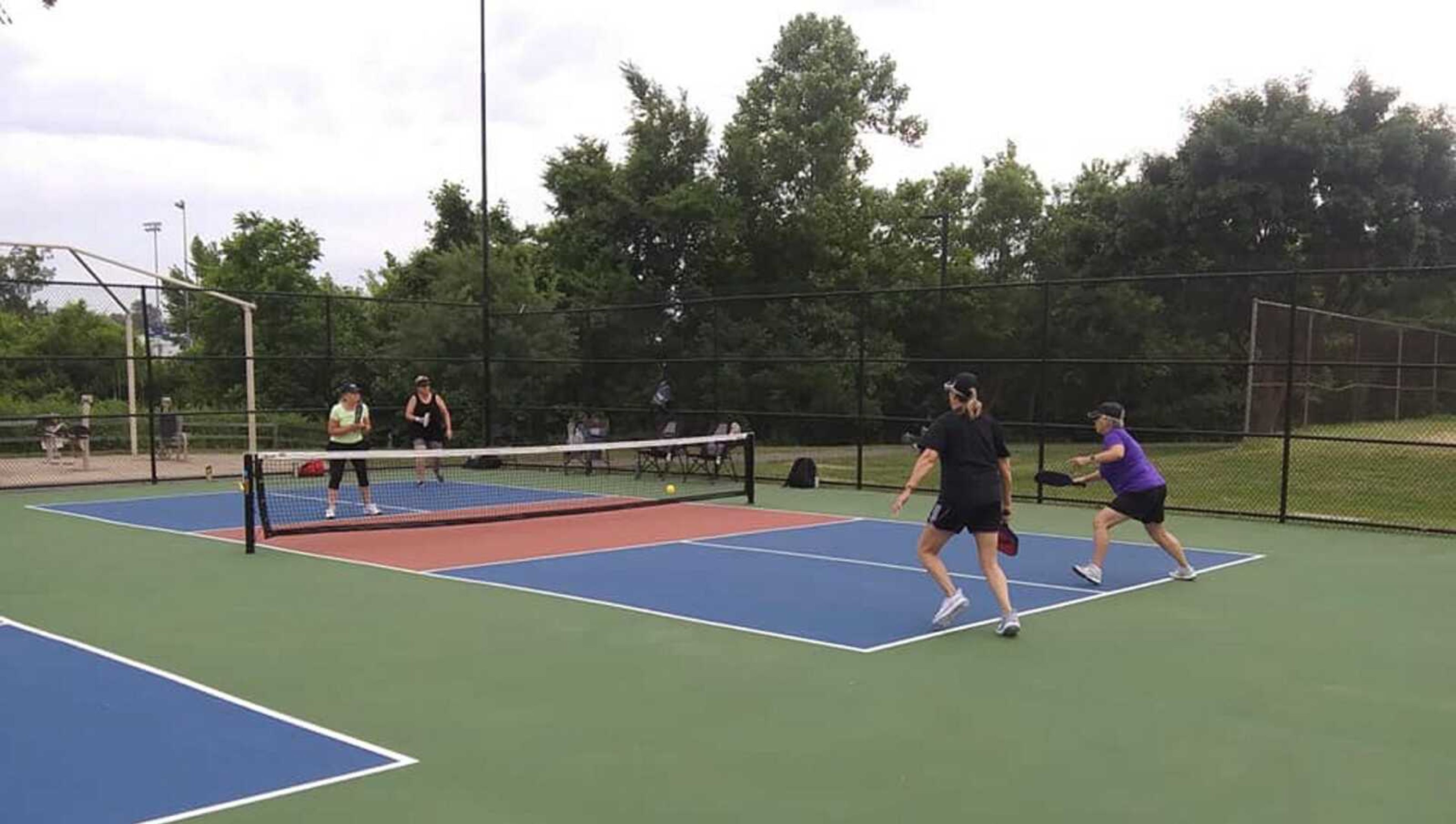 Pickleball players use the new courts Monday at Arena Park.