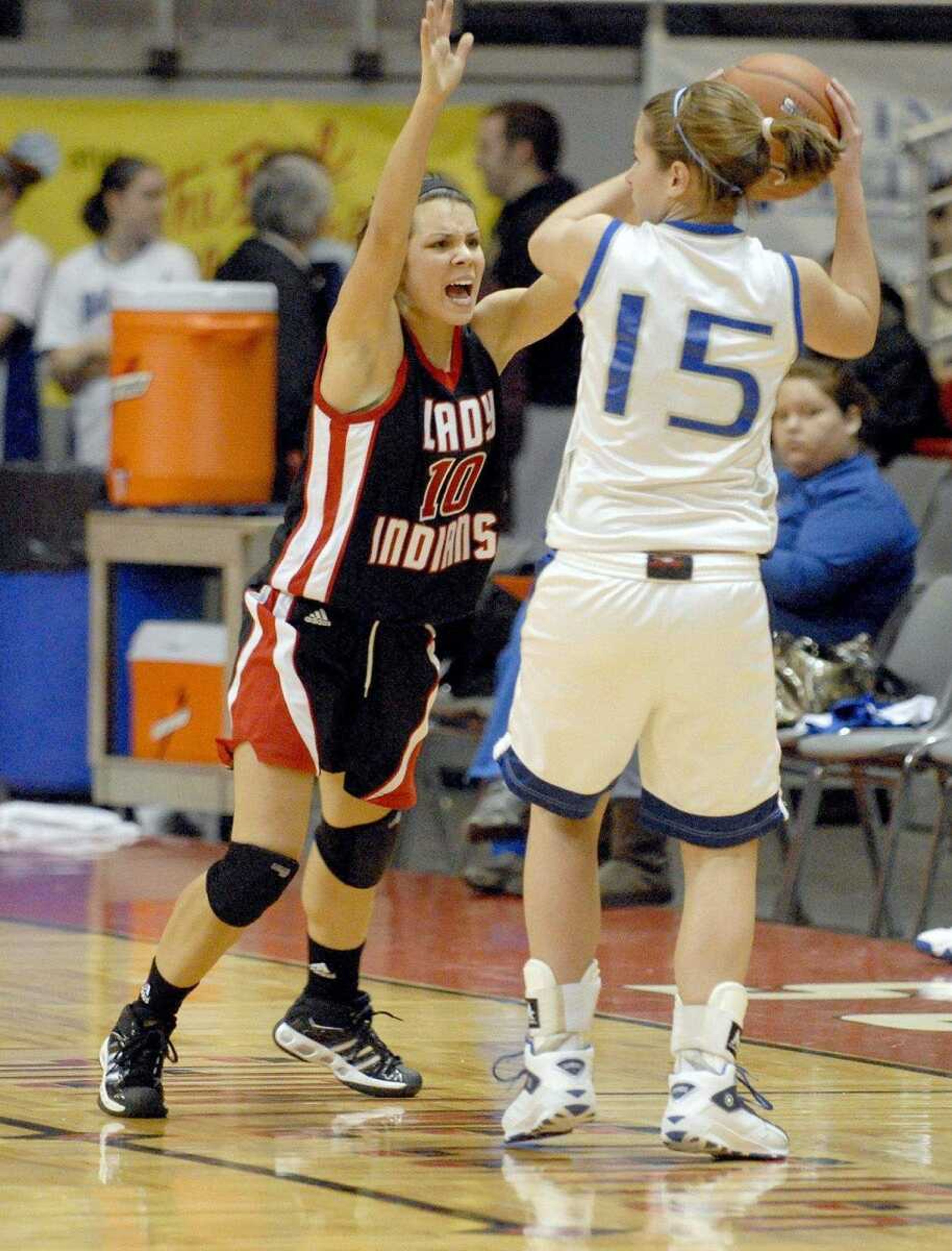 ELIZABETH DODD ~ edodd@semissourian.com
Jackson's Landon Wachter, left, plays defense against Sparta's Rachel Peck in the second half of a last second Jackson victory 35-34 in Holiday Classic Tuesday night at the Show Me Center. Jackson placed third in the tournament.