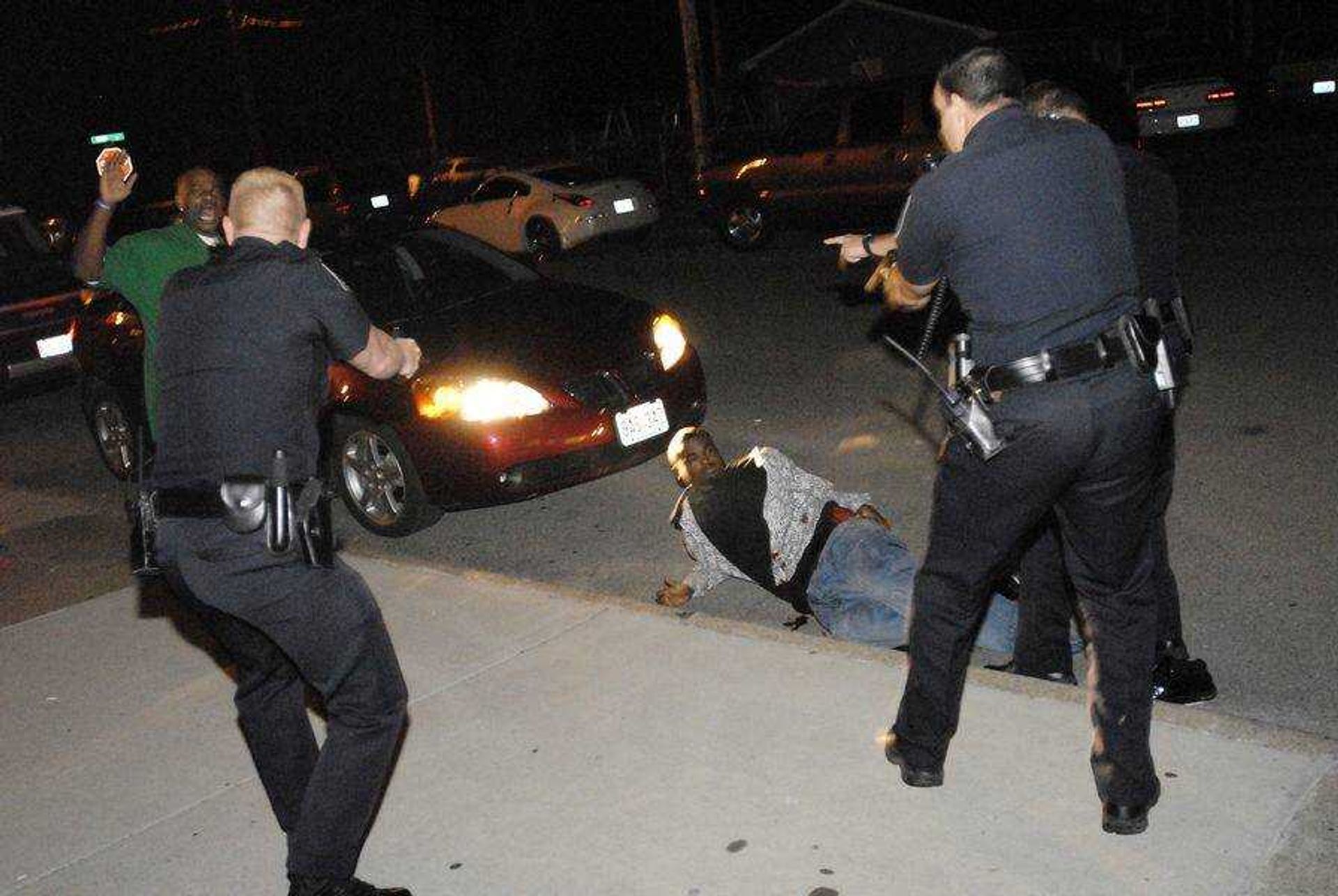 CHUCK WU ~ cwu@semissourian.com
Police surround a suspect as he lies on the ground after being shot by police in an incident outside the Copa on North Main Street early Saturday Morning.