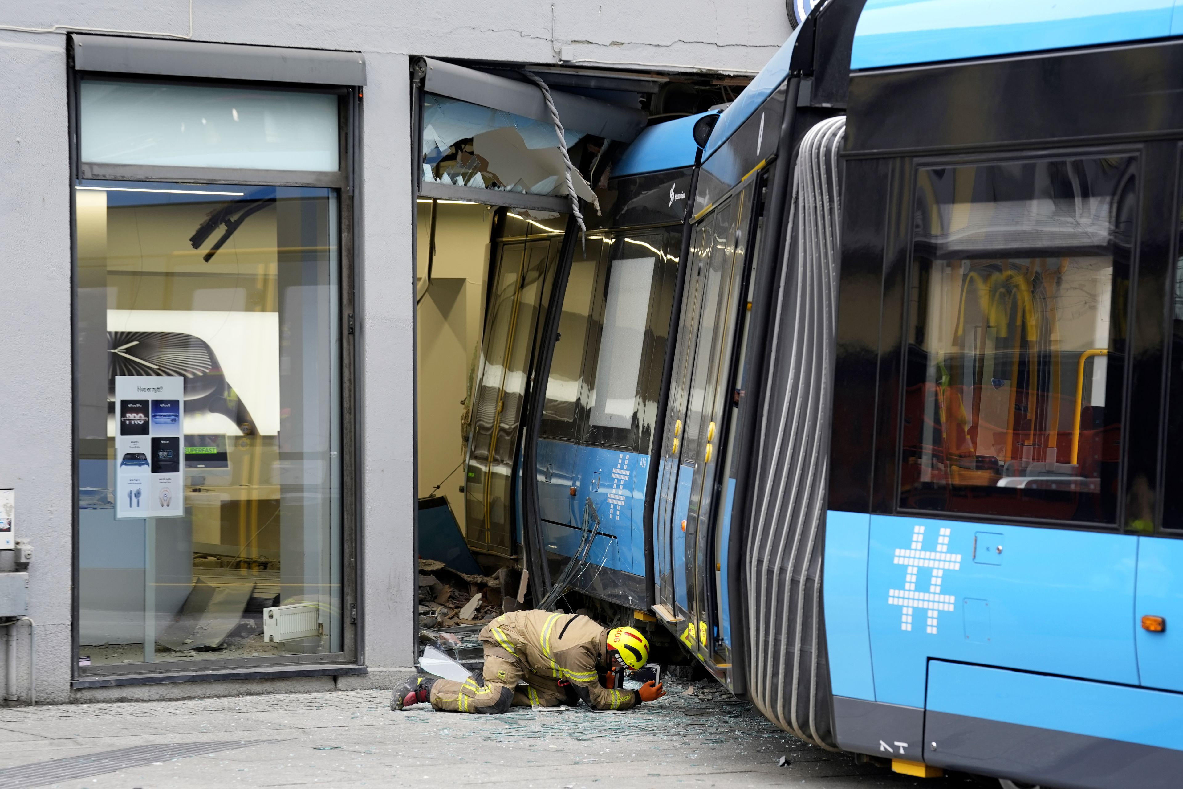 A derailed tram that crashed into a building in downtown Oslo, Norway, Tuesday Oct. 29, 2024. (Terje Pedersen/NTB Scanpix via AP)