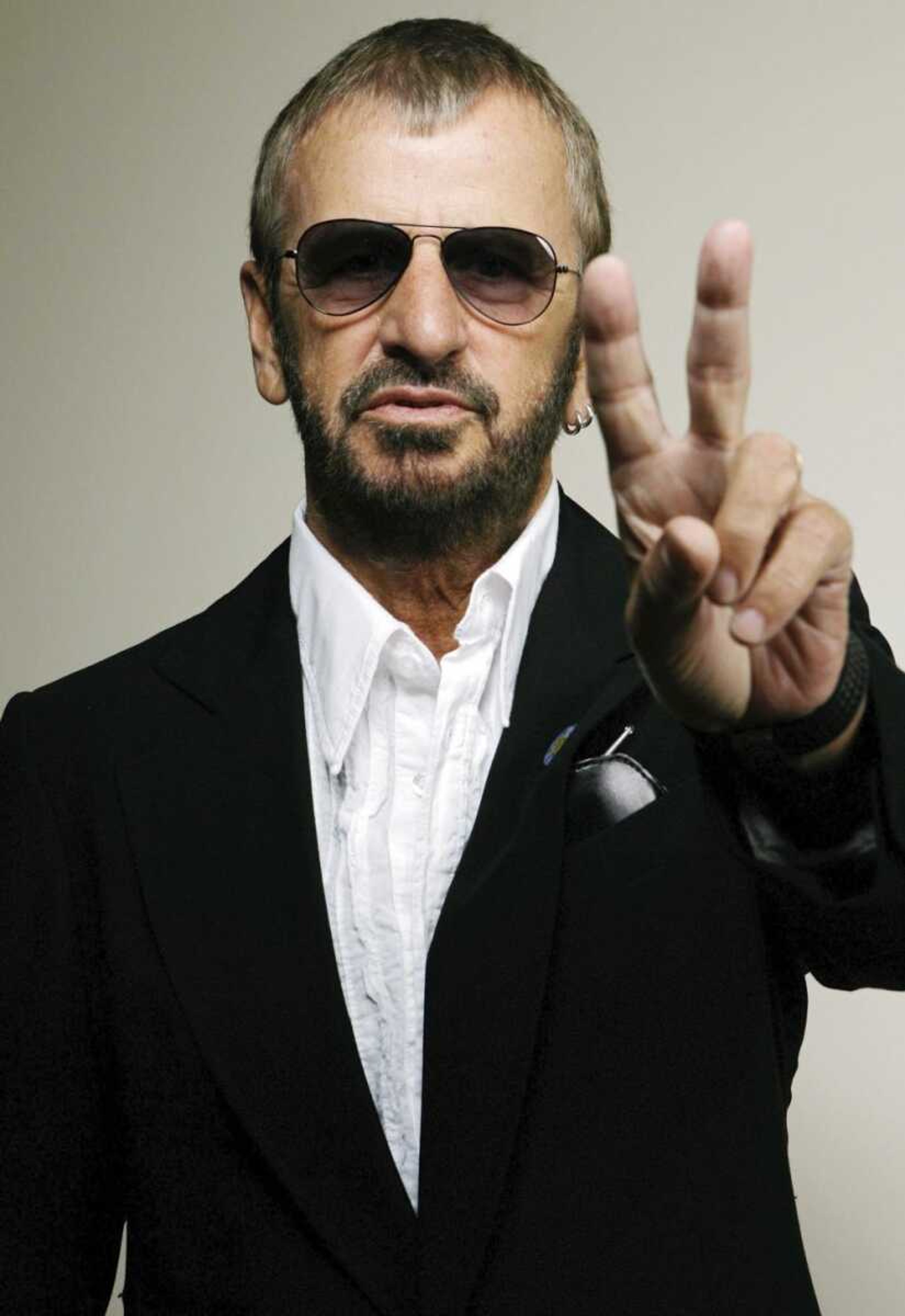 Musician Ringo Starr posed for a photo in Beverly Hills, Calif. His new album, "Photograph: The Very Best of Ringo Starr," hits CD racks Tuesday. (Damian Dovarganes ~ Associated Press)