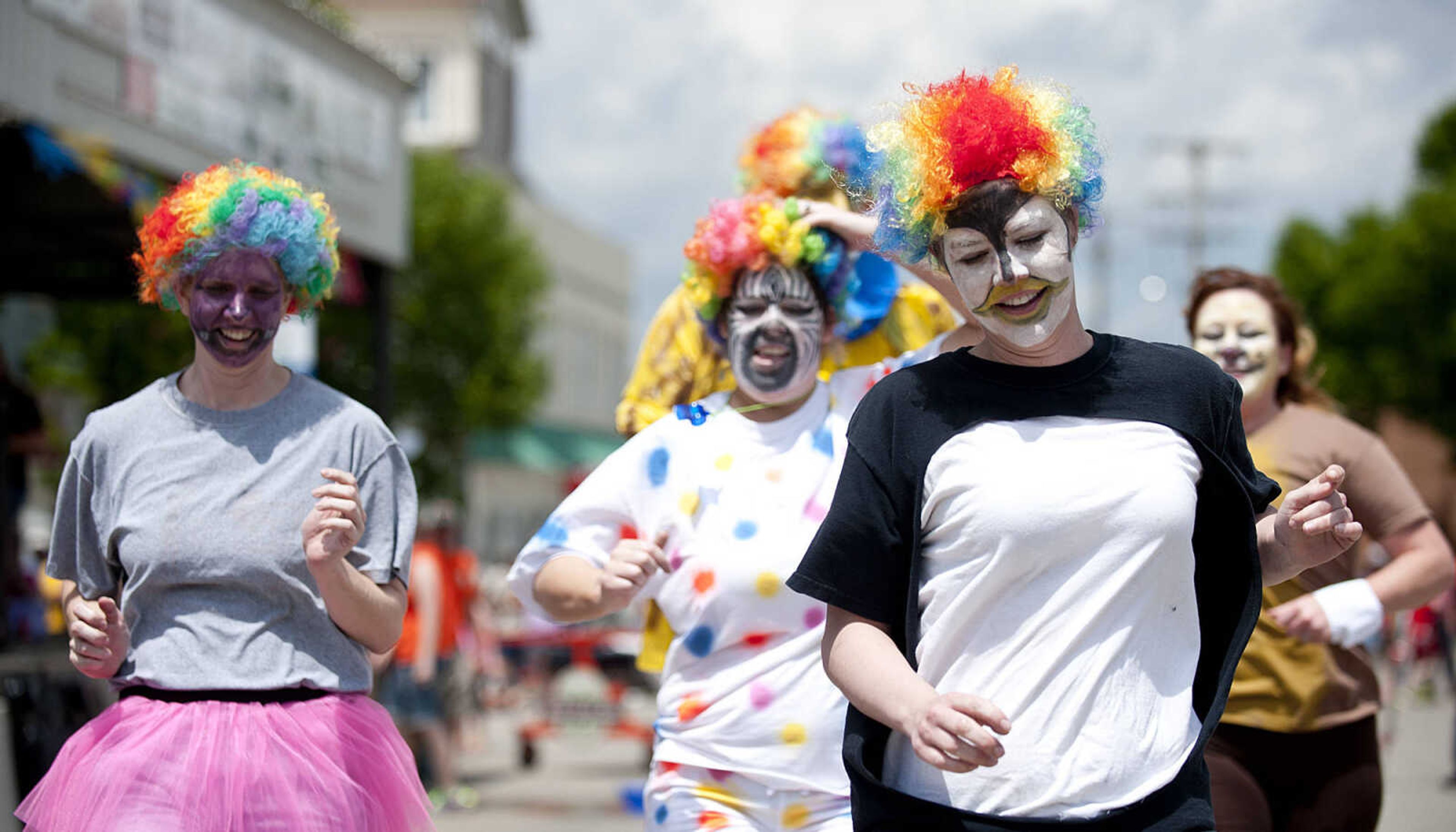 The Afro circus Band team competes in the Perryville Mayfest Bed Races Saturday, May 10, in Perryville, Mo.