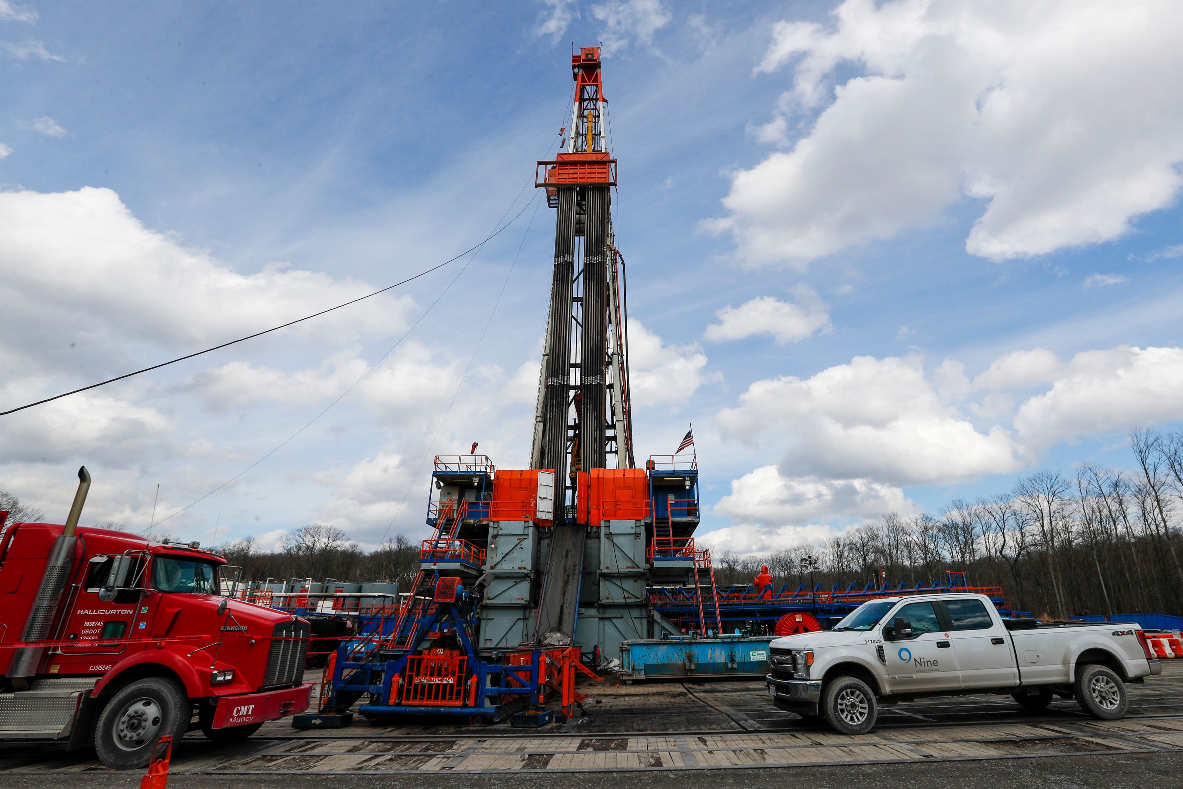 FILE - Work continues at a shale gas well drilling site in St. Mary's, Pa., March 12, 2020. (AP Photo/Keith Srakocic, File)