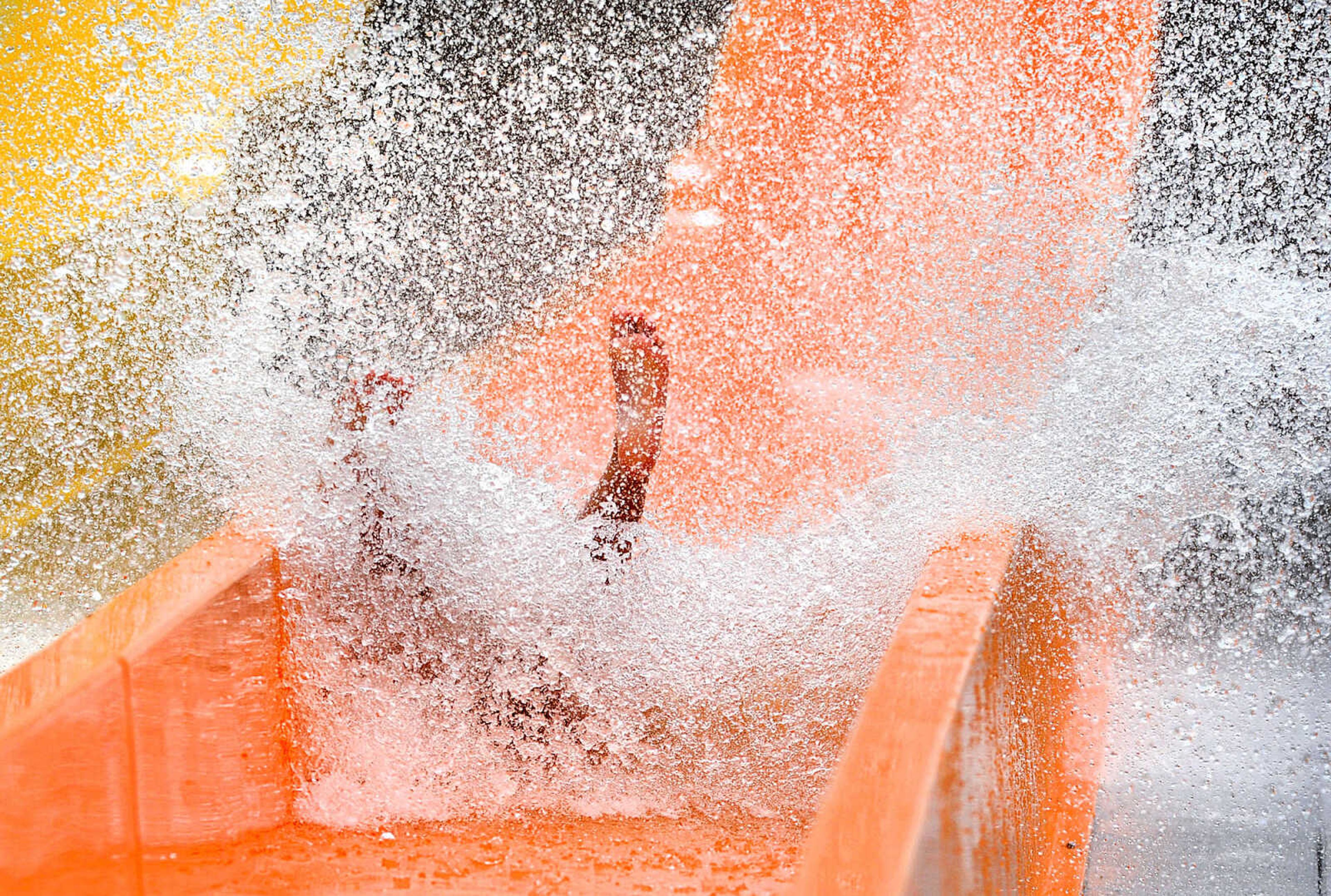 LAURA SIMON ~ lsimon@semissourian.com

The Cape Girardeau Parks and Recreation Department opened the new 265-foot-long free-fall slide, 259-foot-long triple-drop slide and a three-Lane 319-foot-long mat racer with 30-foot tower, at Cape Splash Family Aquatic Center, Thursday, July 9, 2015.