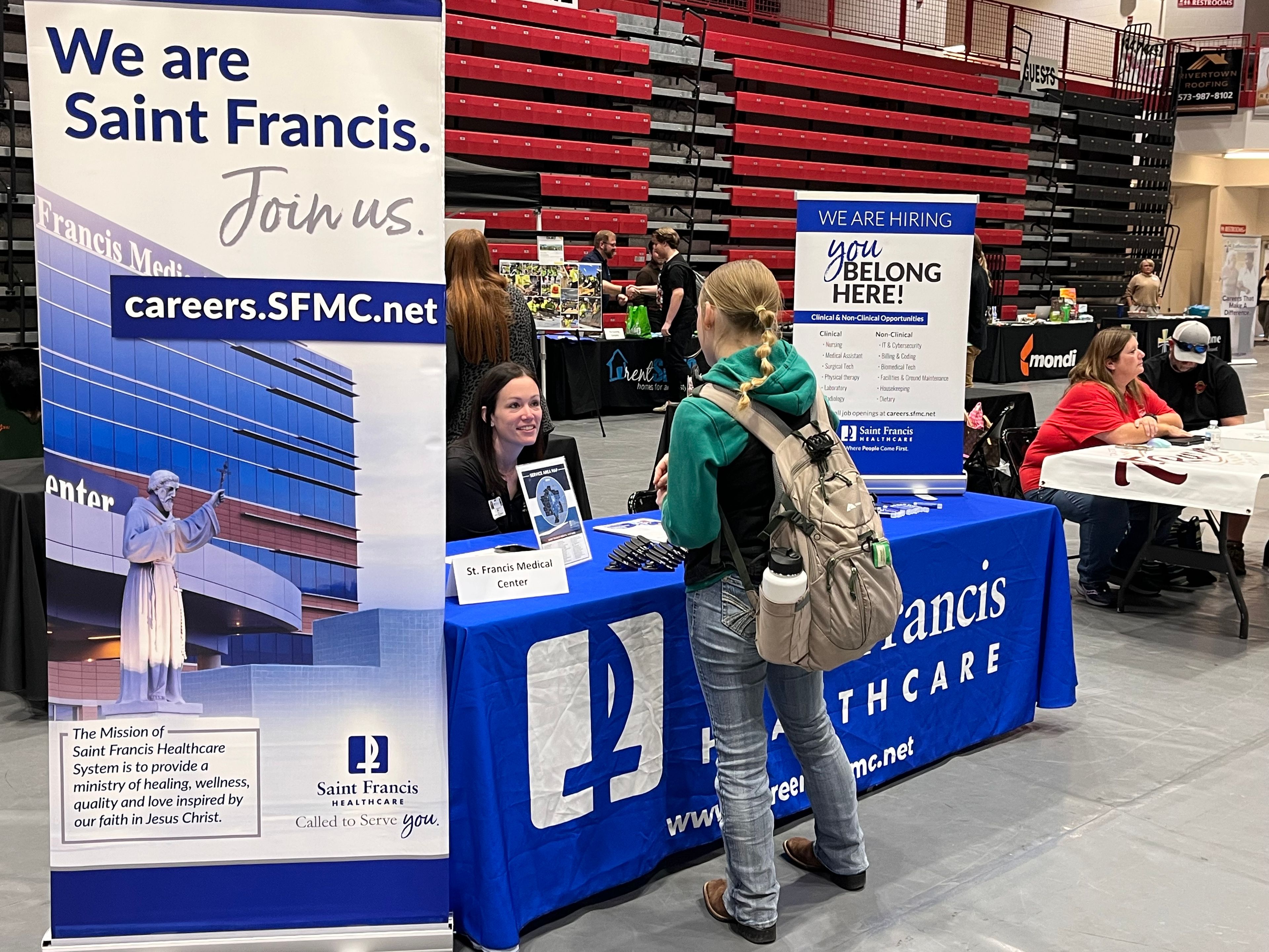 A Jackson High School student talks with a representative of St. Francis Healthcare during the annual Jackson Opportunities in Business (J.O.B.) Fair on Wednesday at JHS. 