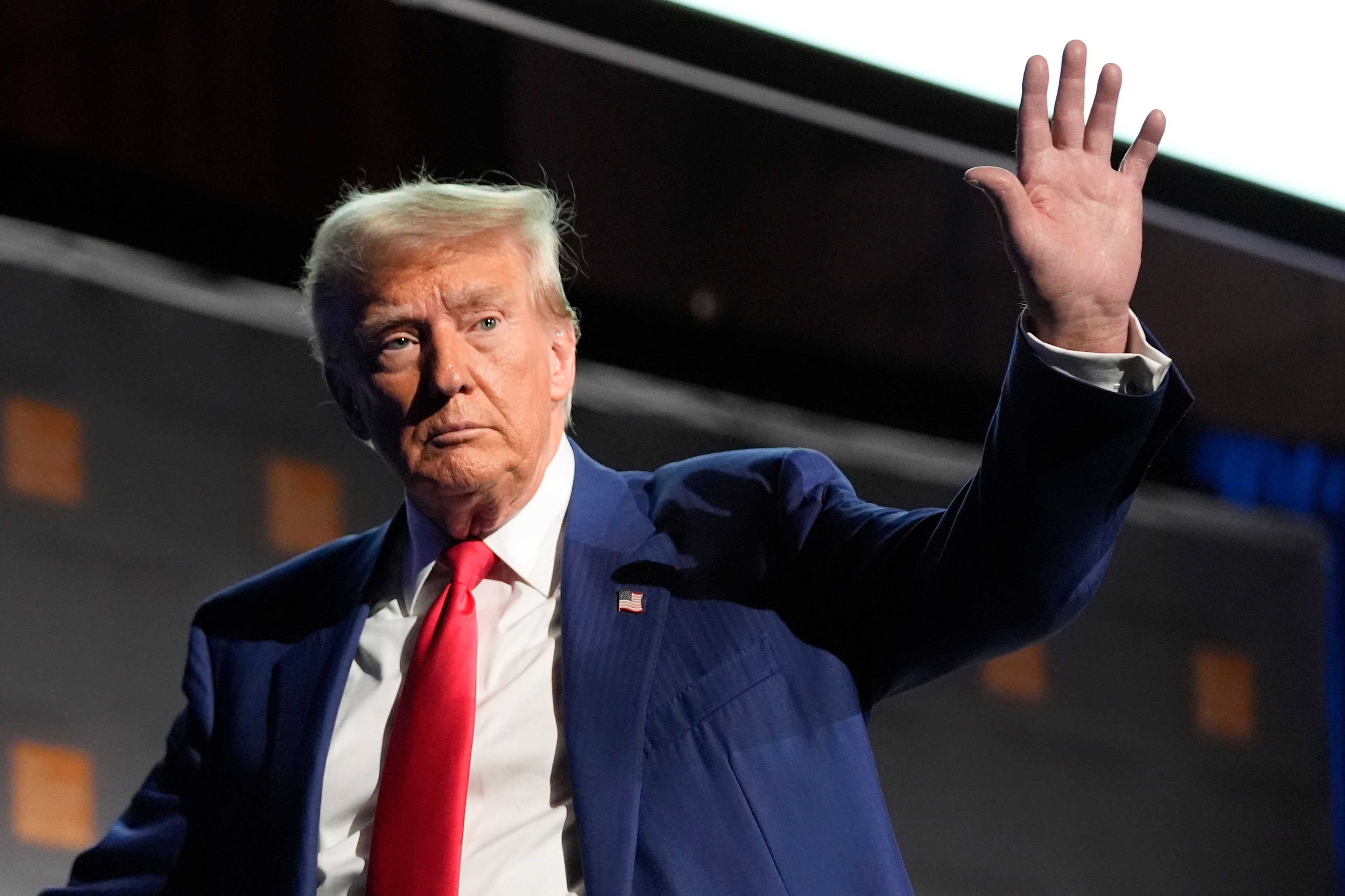 Republican presidential nominee former President Donald Trump waves as he departs a campaign event at the Economic Club of New York, Thursday, Sept. 5, 2024, in New York. (AP Photo/Alex Brandon)