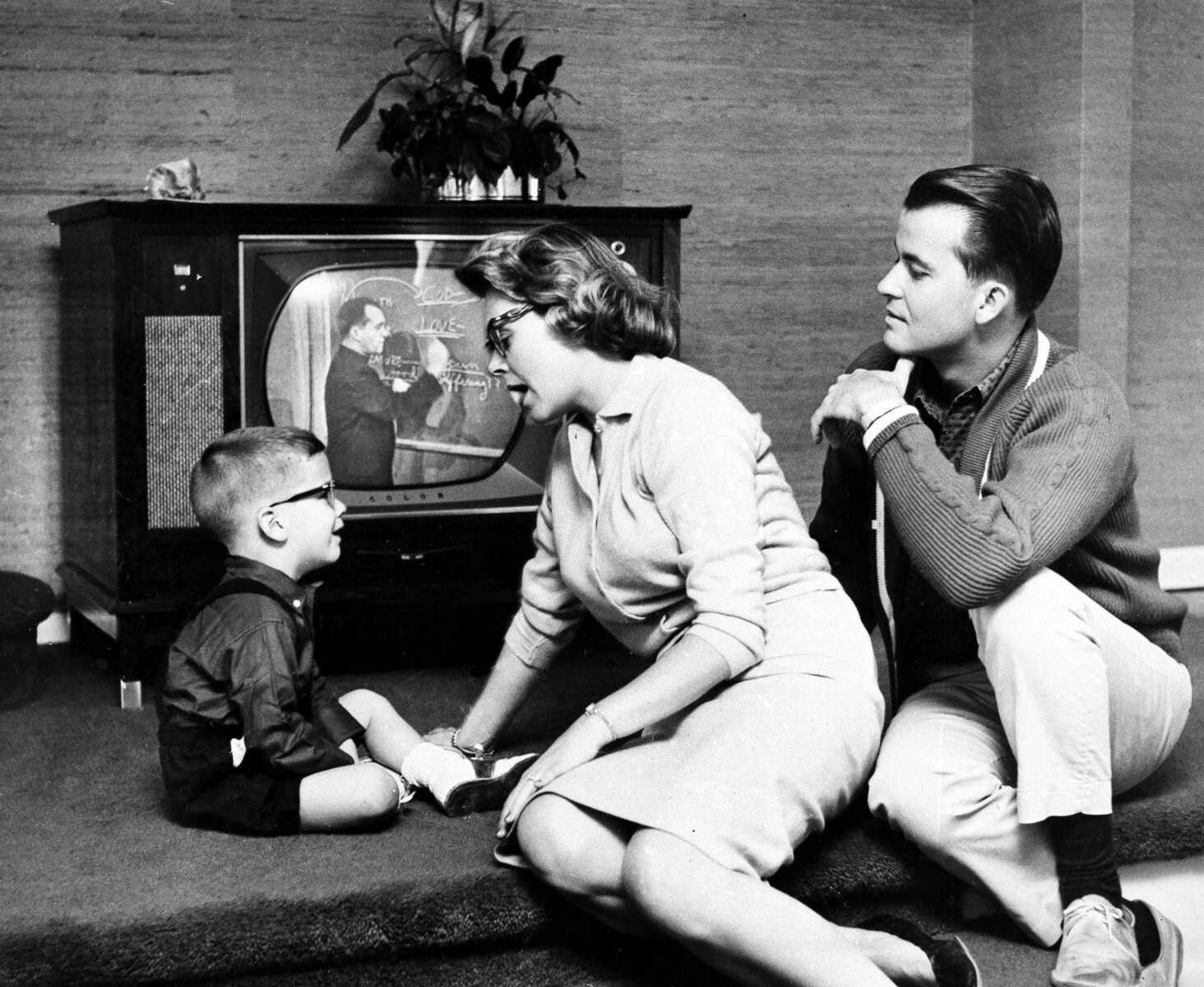 FILE - This July 26, 1960 file photo shows Dick Clark and Barbara Mallery with their son, Richard, 3, in their home near Philadelphia. Clark, the ever-youthful television host and tireless entrepreneur who helped bring rock `n' roll into the mainstream on "American Bandstand," and later produced and hosted a vast range of programming from game shows to the New Year's Eve countdown from Times Square, died of a heart attack on Wednesday, April 18, 2012. He was 82. (AP Photo, file)