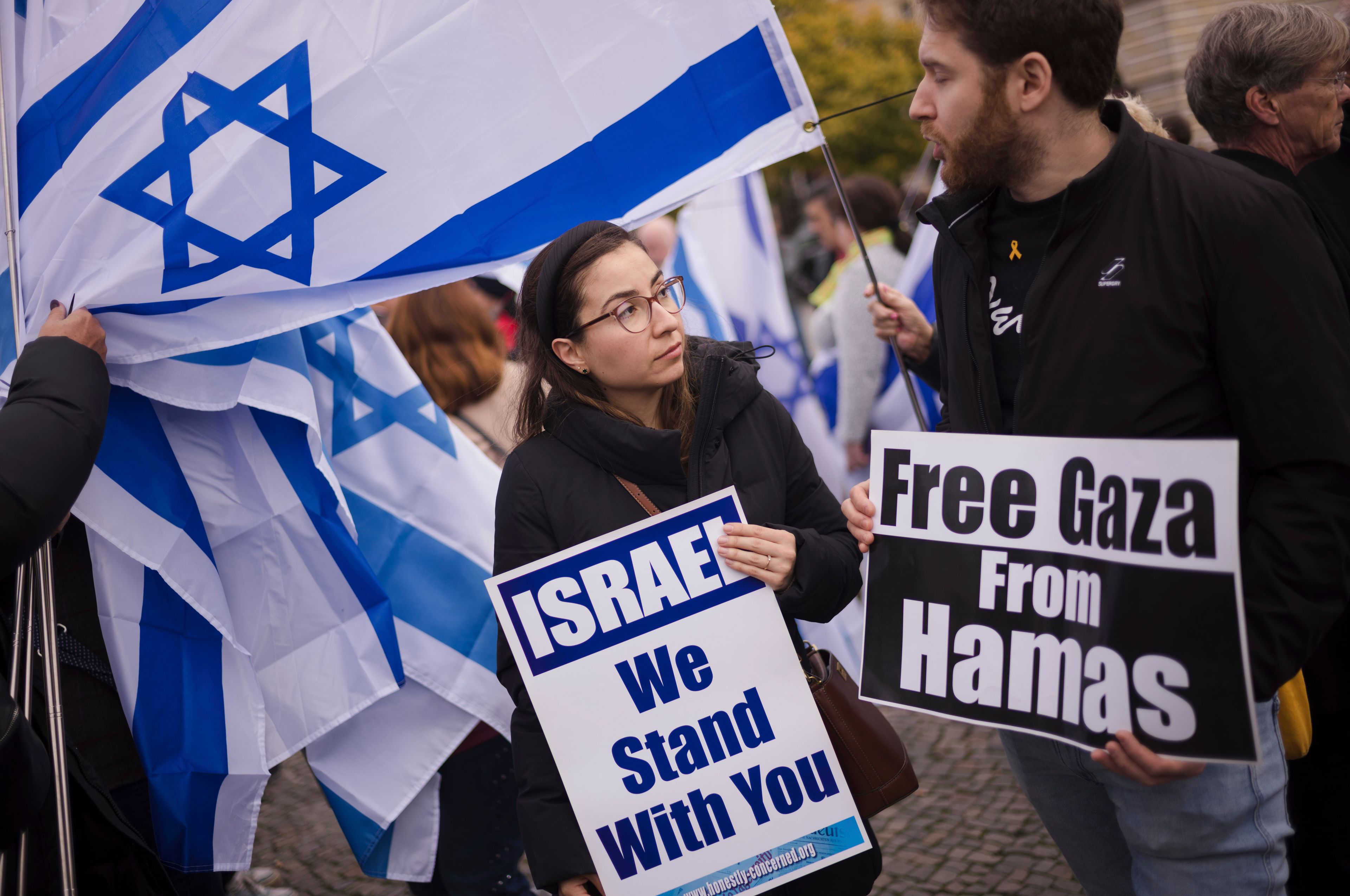 People attend a demonstration in support of Israel to mark the first anniversary of the Hamas attack on Israel, at the Brandenburg Gate in Berlin, Germany, Sunday, Oct. 6, 2024. (AP Photo/Markus Schreiber)