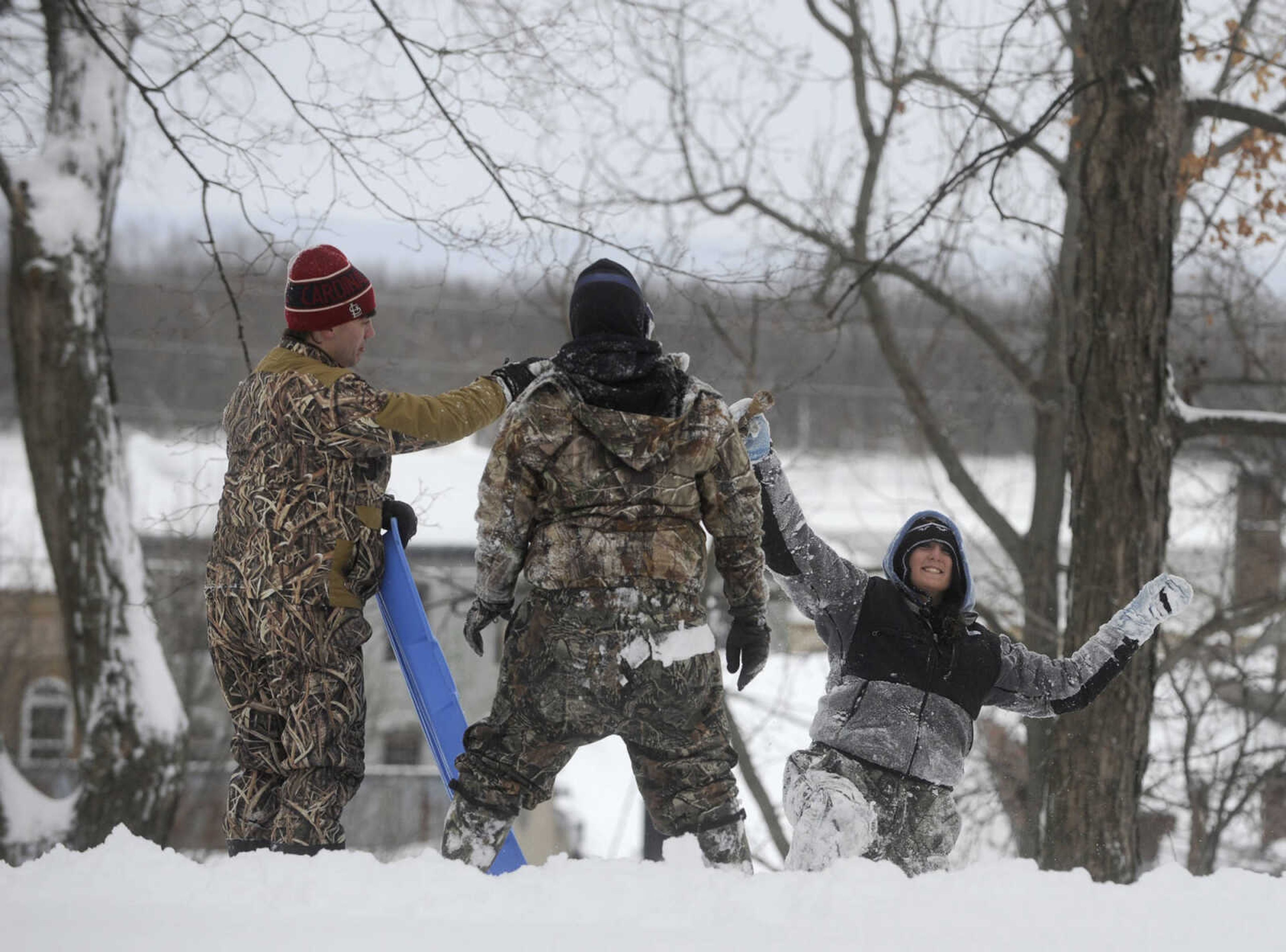 LAURA SIMON ~ lsimon@semissourian.com

People sled down the hillside outside the Common Pleas Courthouse, Monday, Feb. 16, 2015, in Cape Girardeau.