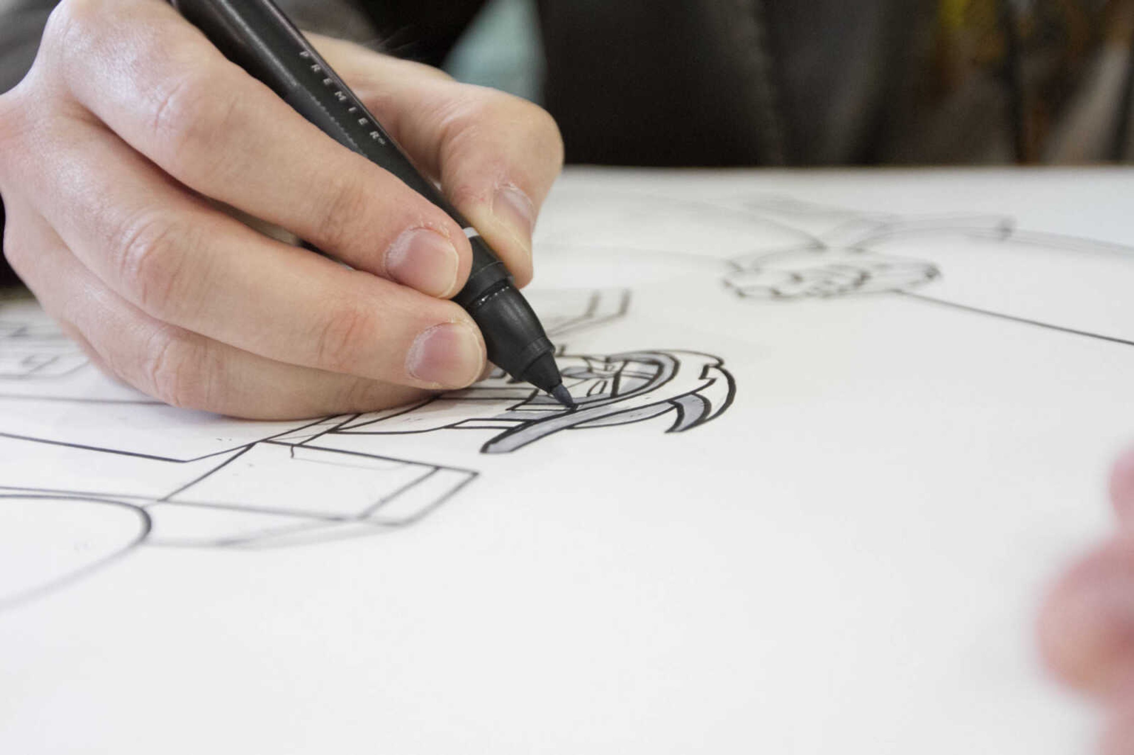 GLENN LANDBERG ~ glandberg@semissourian.com


Nathan Bonner works on a sketch of Galvatron at his booth during Cape Comic Con Friday, April 17, 2015 at the Osage Centre.