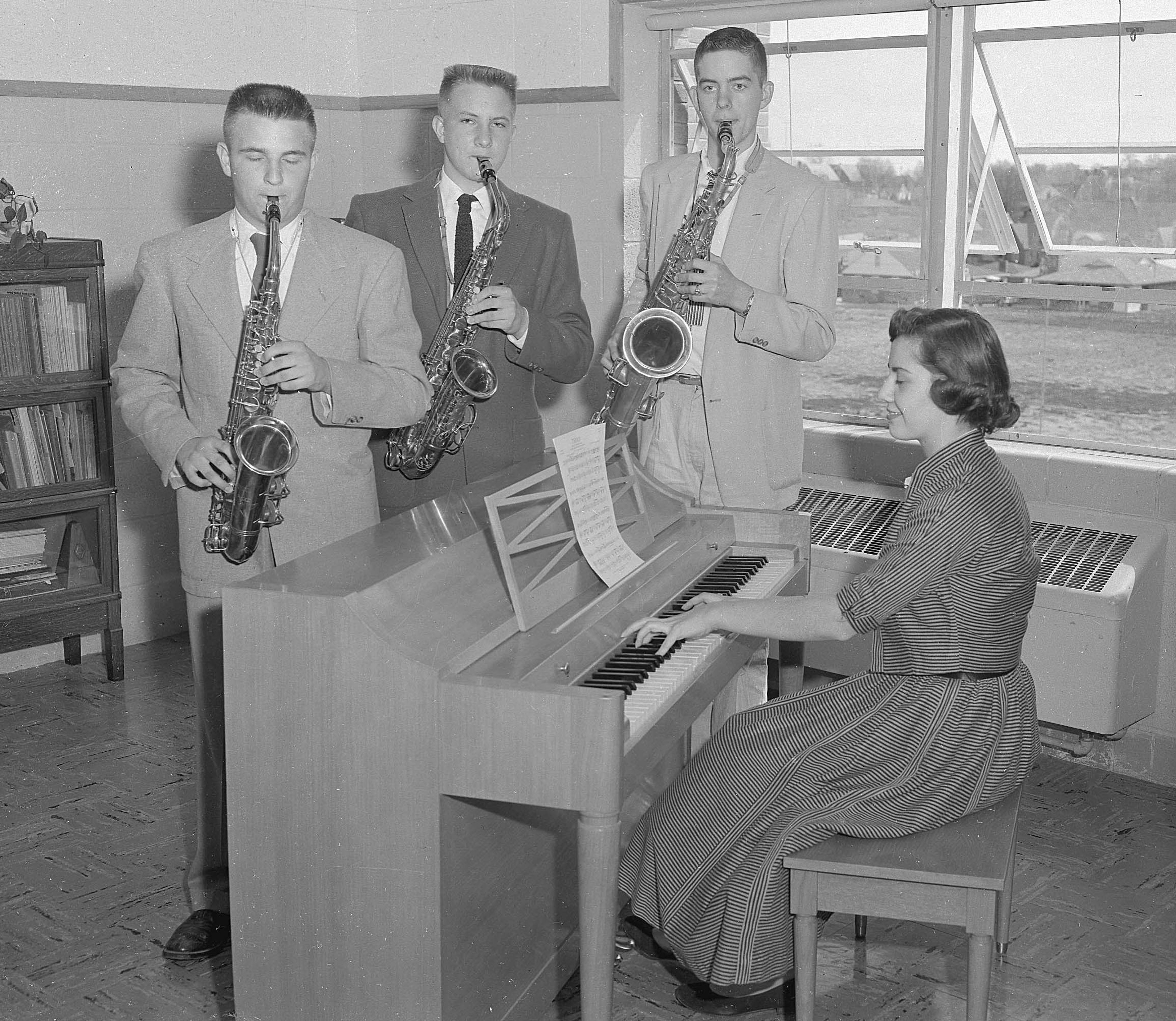 Published Saturday, March 31, 1956
This is the saxophone trio and the piano accompanist from Cape Catholic High School which was awarded top honors in that division in the annual musical festival at Fontbonne College in Clayton on March 14. The trio, reading left to right, is composed of Larry Trickey, Charles Fuerth and Jim Nenninger, and Miss Mary Jo Rehg is the accompanist. Sister Doralice is the music director at the local high school and accompanied the group to Clayton.