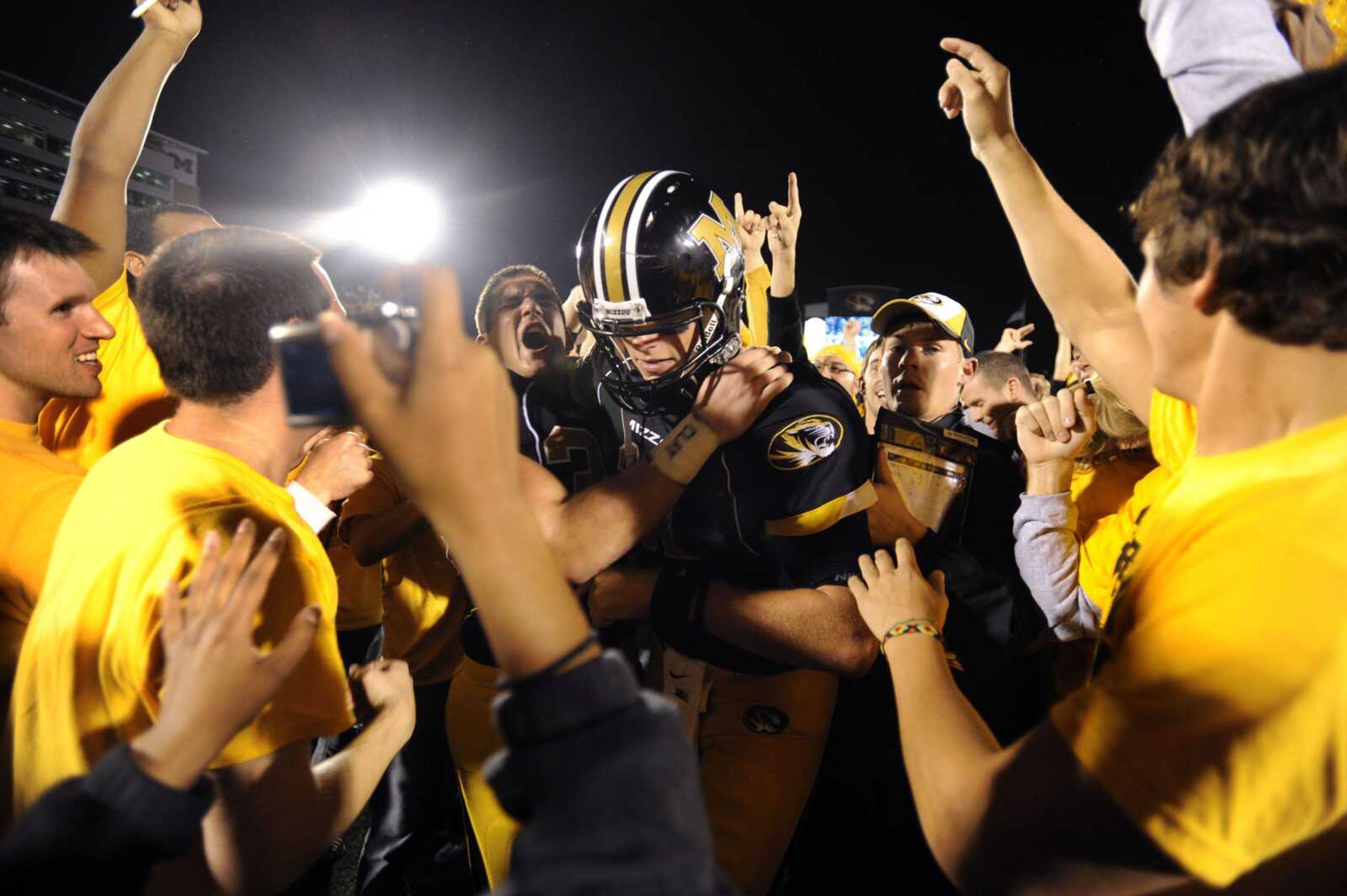 Missouri quarterback Blaine Gabbert is surrounded by fans Saturday after the Tigers defeated Oklahoma 36-27 in Columbia, Mo. (L.G. PATTERSON ~ Associated Press)