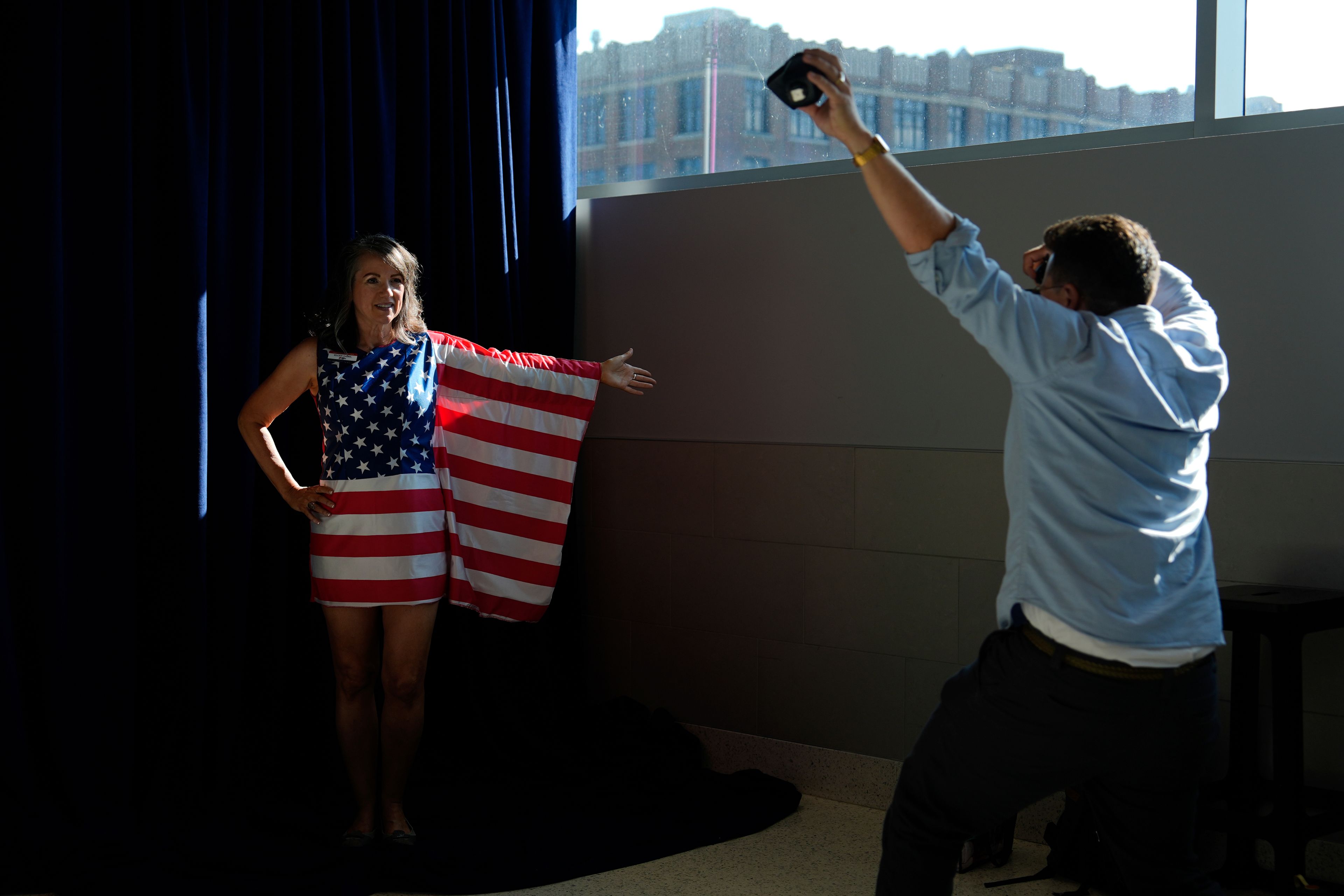 FILE - A person in American flag poses for pictures during the Republican National Convention Thursday, July 18, 2024, in Milwaukee. (AP Photo/Julia Nikhinson, File)