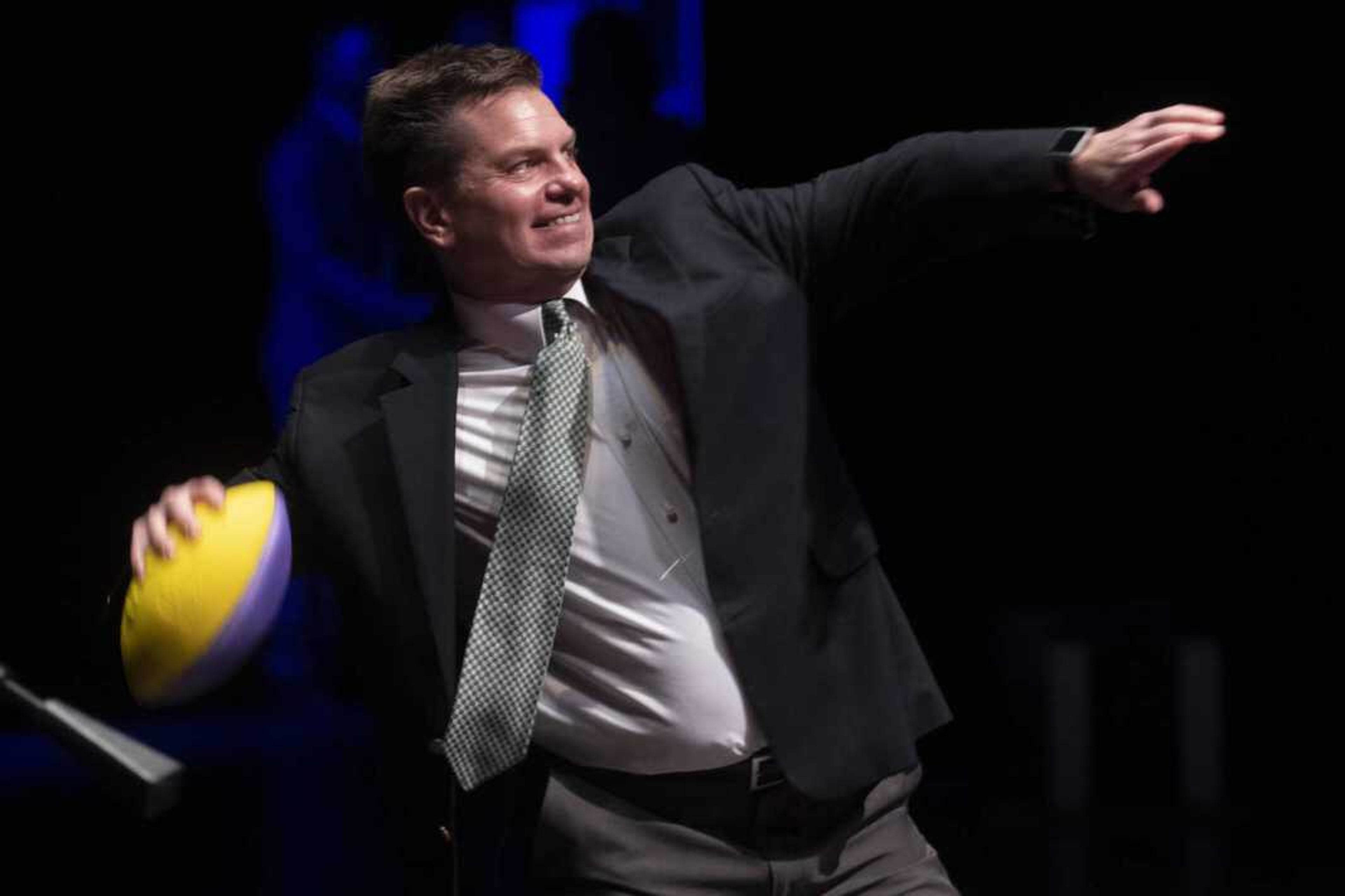 Rust Communications co-president Rex Rust prepares to throw a ball at the 2019 Semoball Awards on July 13, 2019, at Southeast Missouri State University River Campus in Cape Girardeau.