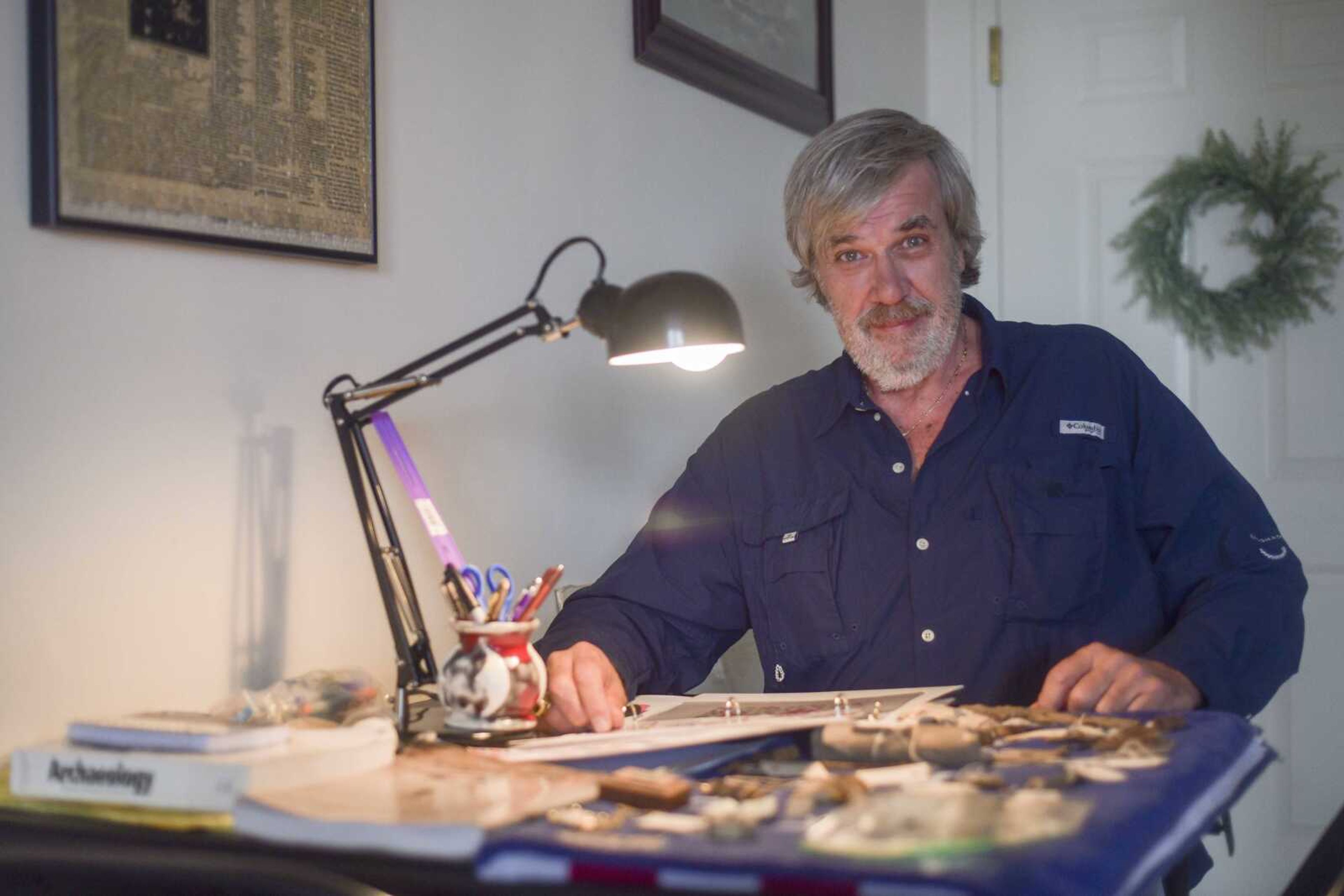 Author Randy Barnhouse poses for a portrait with artifacts he recovered from the boyhood home of Samuel Clemens Wednesday, Jan. 15, 2020, at Barnhouse's home in Cape Girardeau.