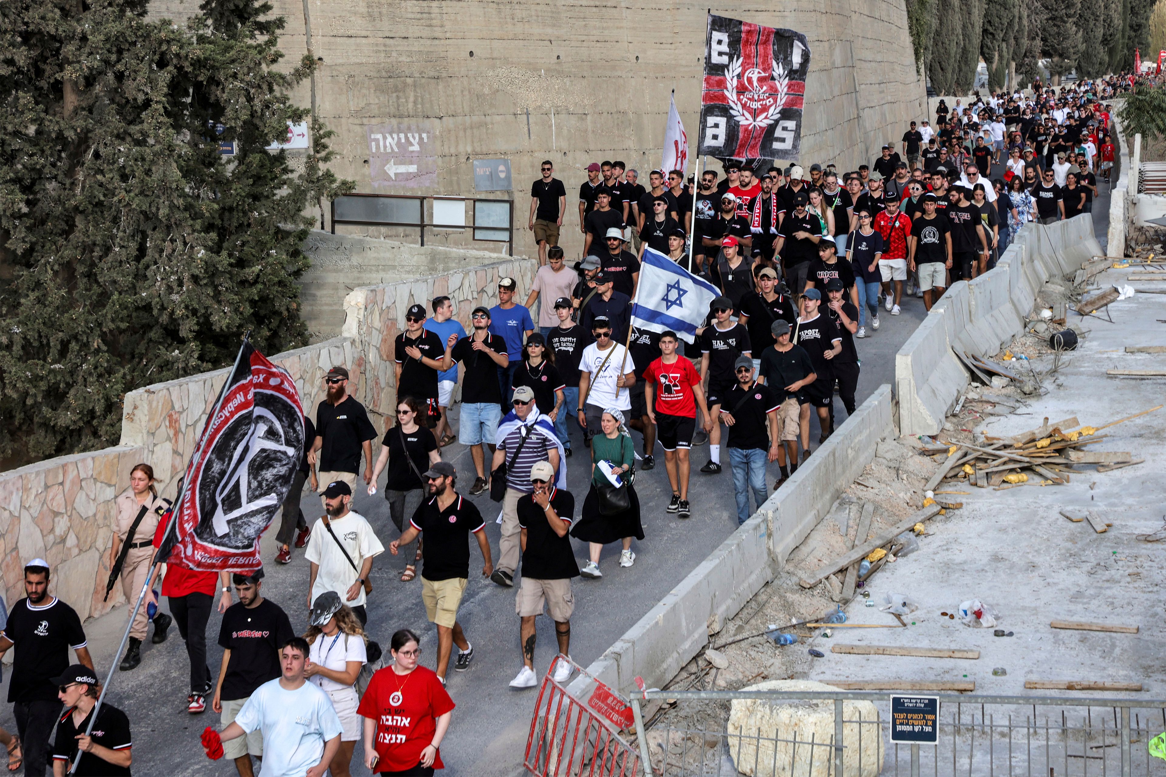 Mourners attend the funeral of Israeli-American hostage Hersh Goldberg-Polin, who was killed in Hamas captivity in the Gaza Strip, in Jerusalem, Monday, Sept. 2, 2024. (Gil Cohen-Magen/Pool via AP)