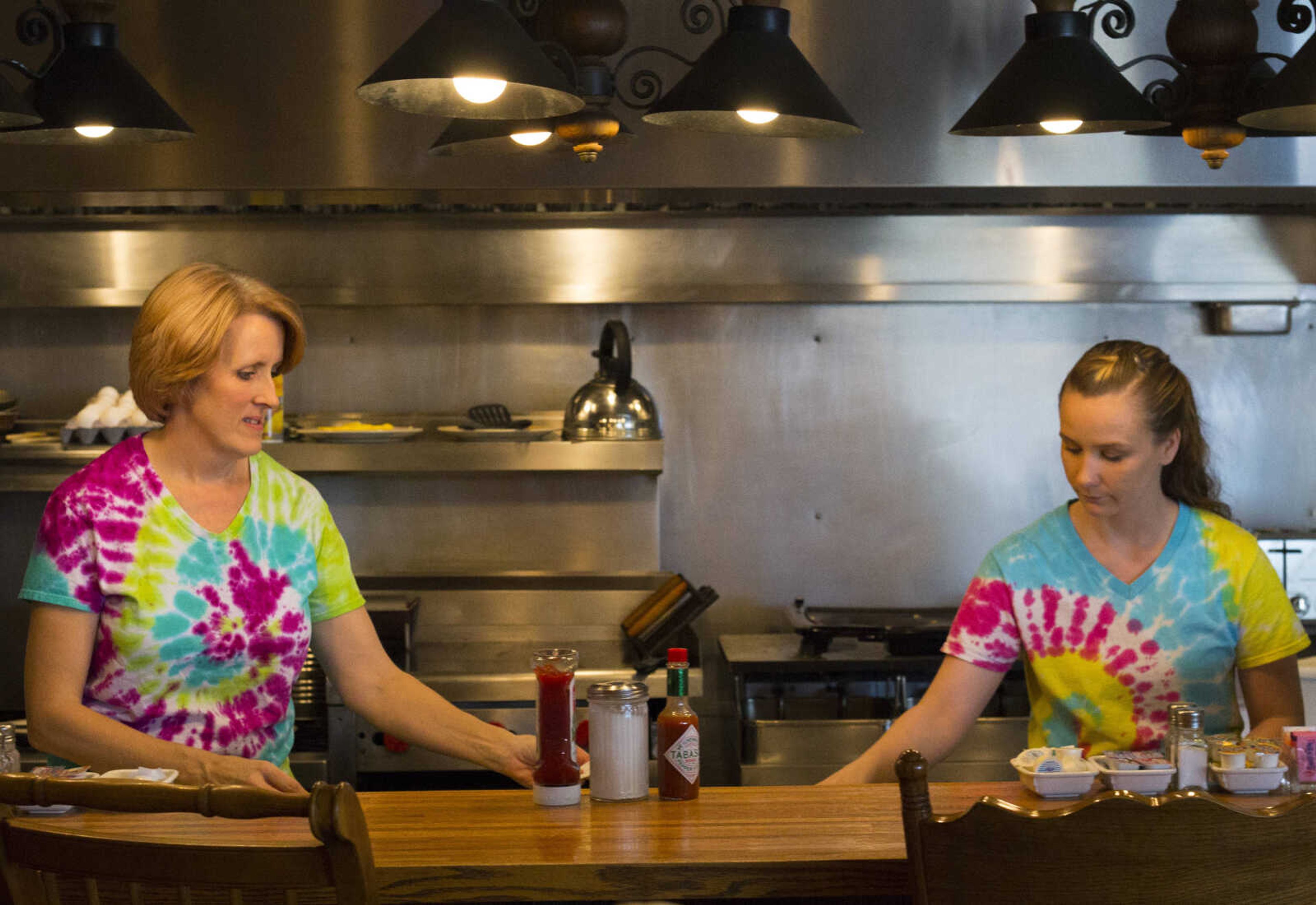 The Pie Bird Cafe staff tidy up the kitchen after serving lunch on March 19, 2017 in Jackson.