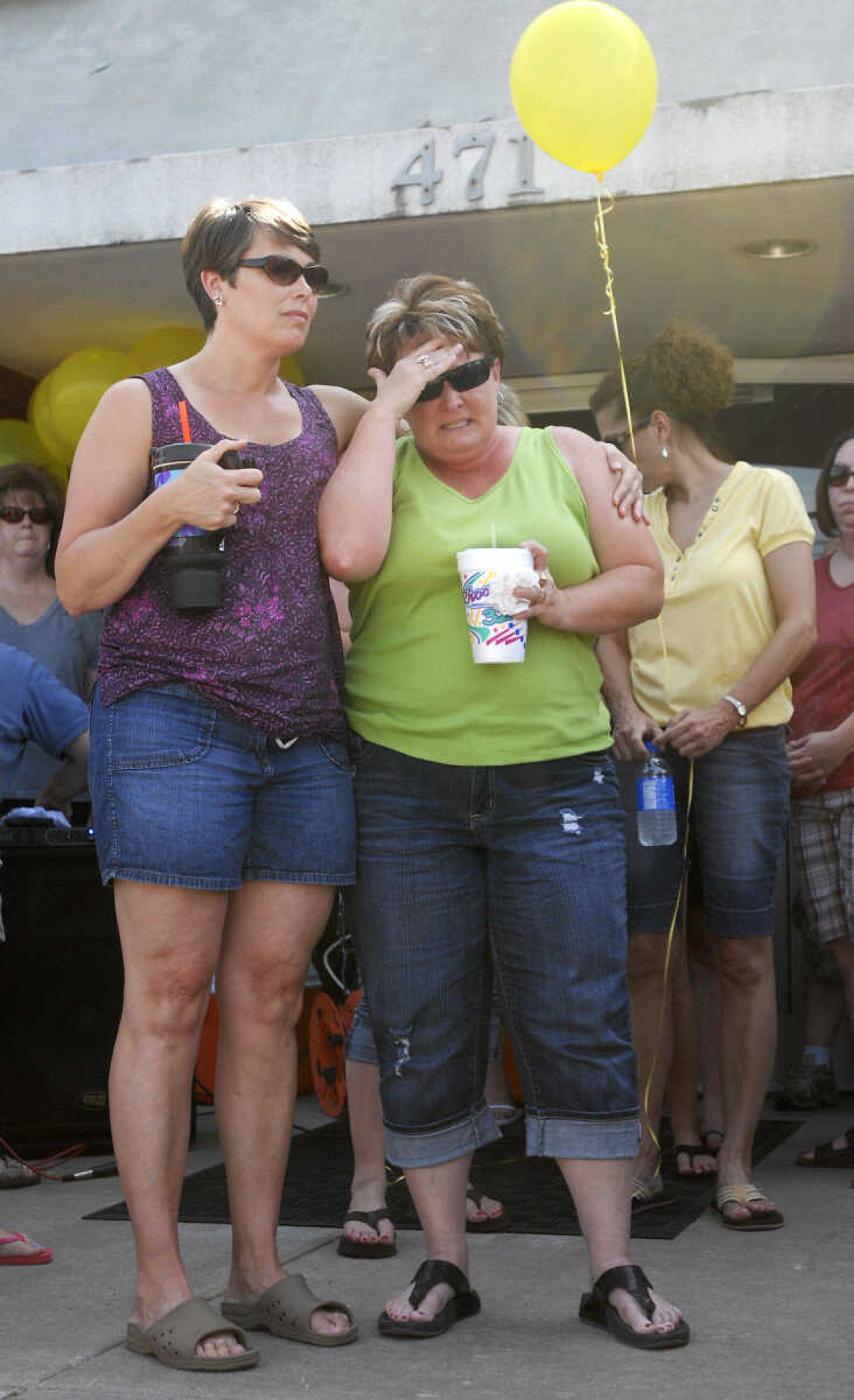 KRISTIN EBERTS ~ keberts@semissourian.com

Barbie Gibbs, left, consoles Cheryl Brenneke, right, during a prayer service for Brenneke's sister, Jacque Sue Waller, at Anthem Blue Cross Blue Shield in Cape Girardeau on Saturday, June 4, 2011. Waller, a 39-year-old mother of three has been missing since Wednesday.