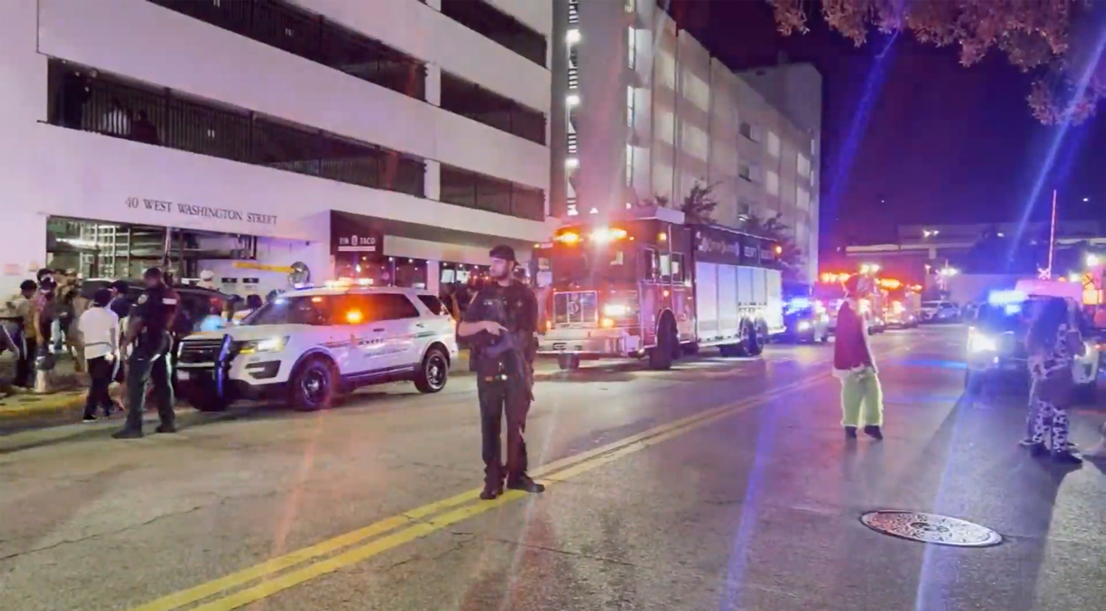 Police investigate the scene of two shootings that took place among crowds during Halloween celebrations early Friday, Nov. 1. 2024 in Orlando, Fla. (WFTV via AP)