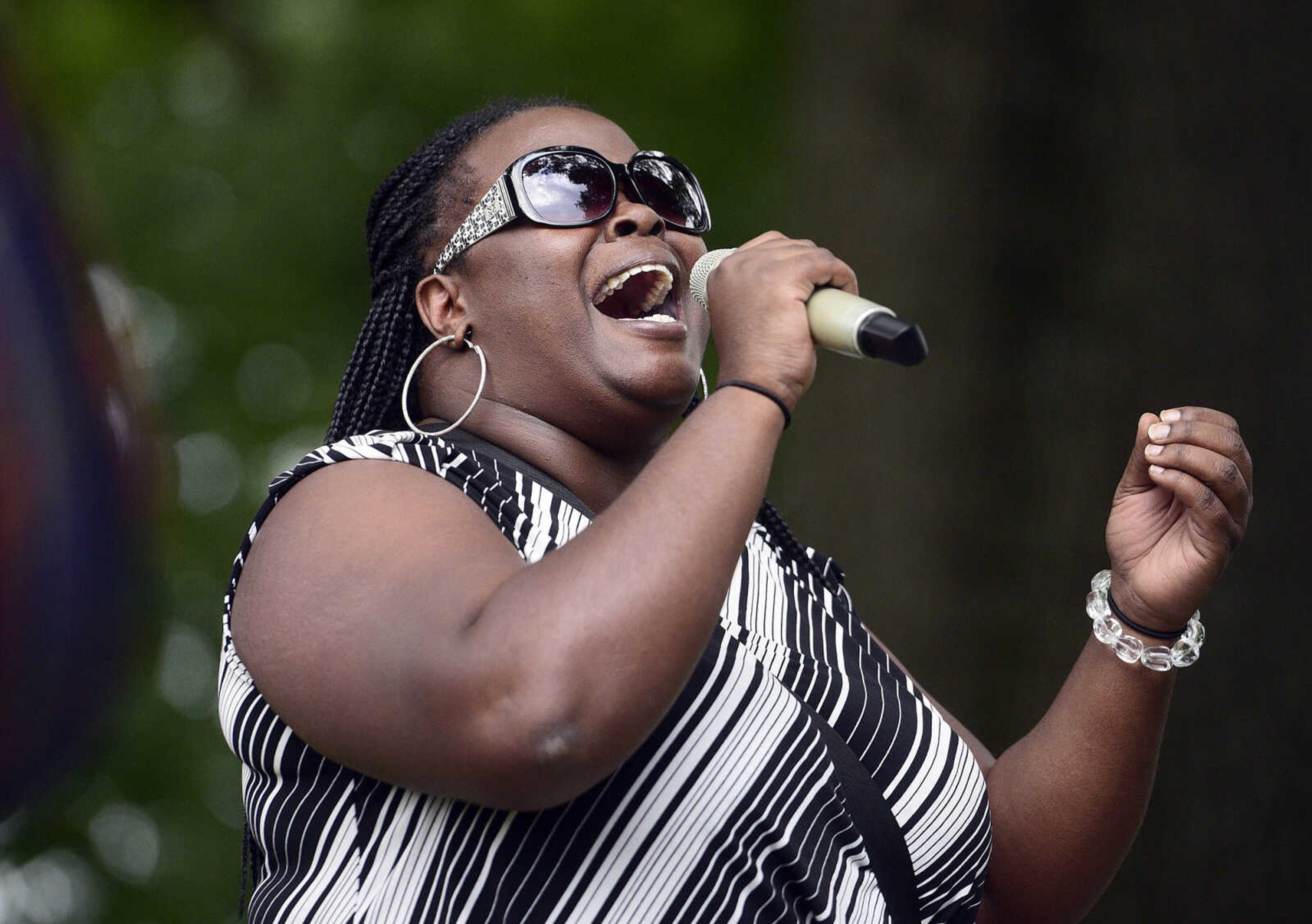 Ramona Bailey sings "It is Well" during a Love, Not Hate rally on Sunday evening, Aug. 13, 2017, at Ivers Square in Cape Girardeau.