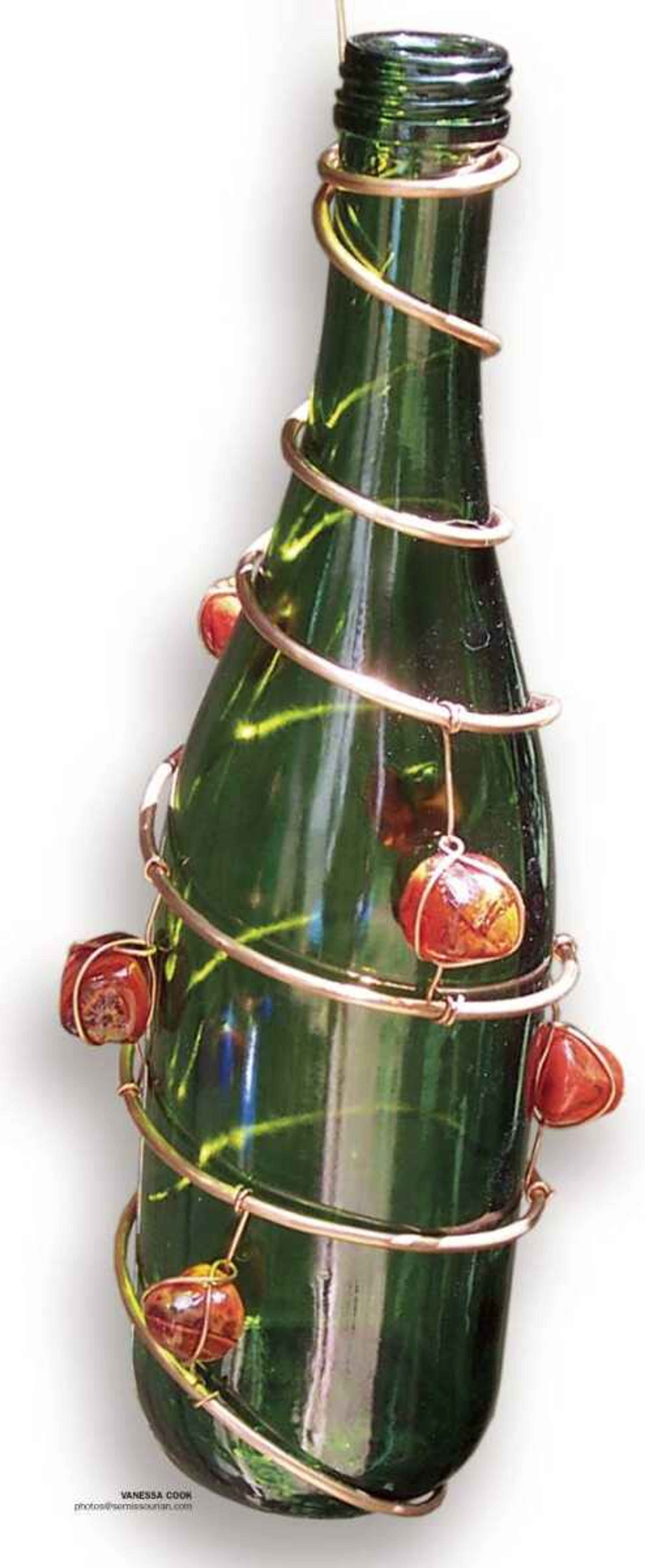 Recycle your bottles by turning them into beautiful -- and functional -- backyard decorations.