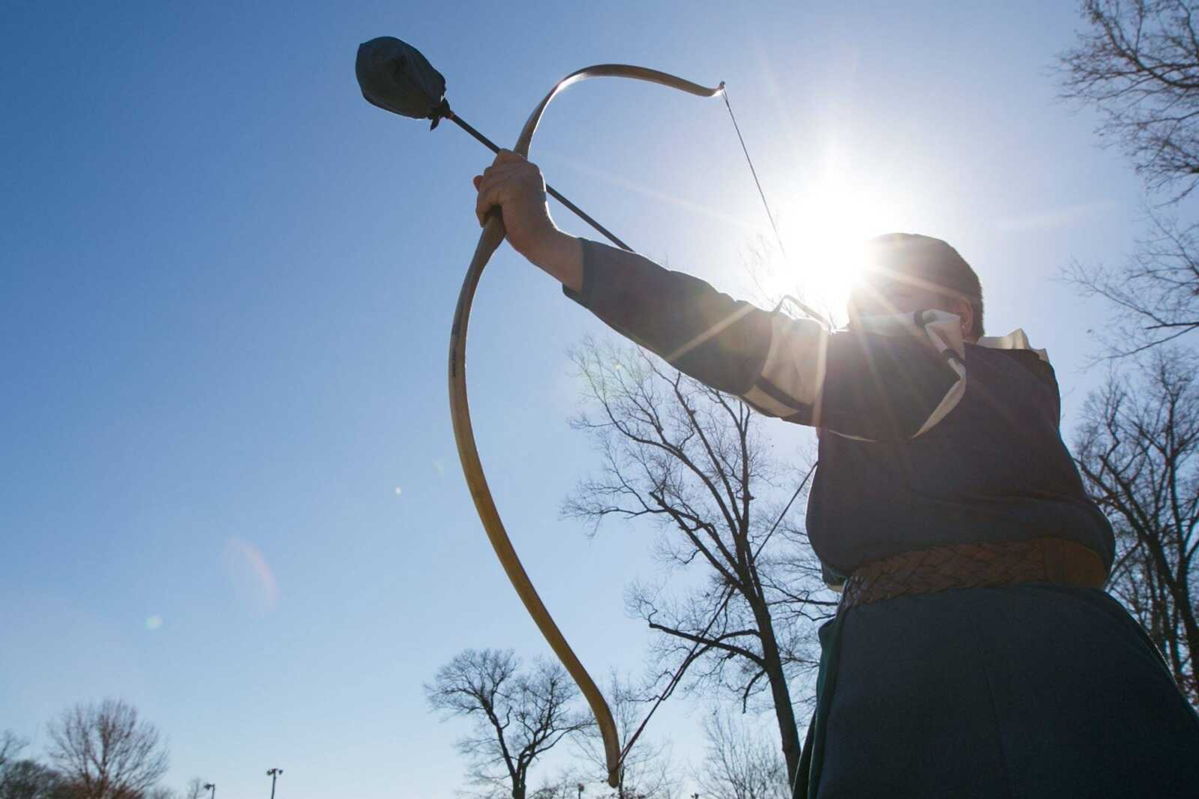 Samantha Killion fires a modified arrow during an Amtgard practice Saturday at Arena Park in Cape Girardeau.