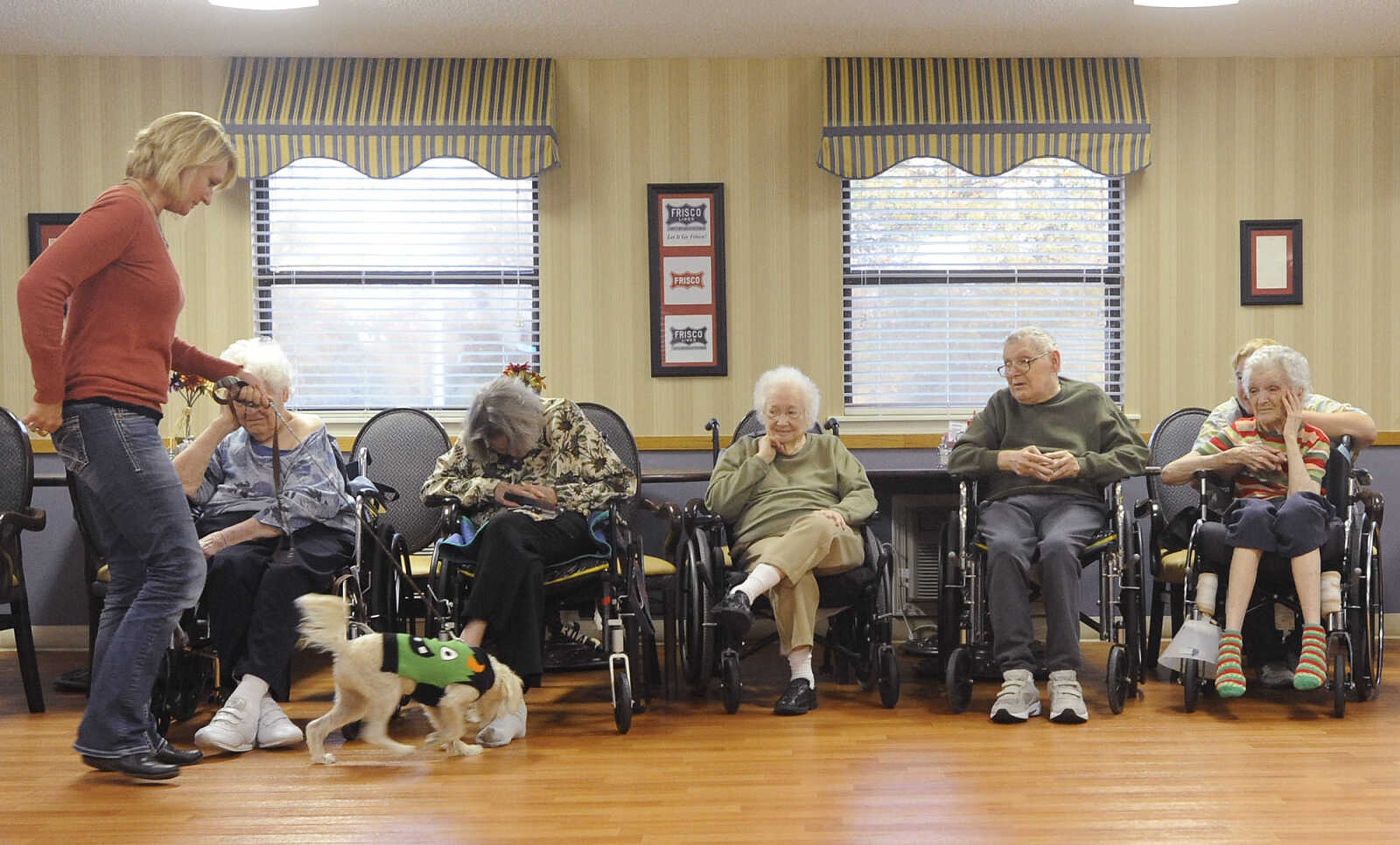 Charlie and his owner Gail Heisserer visit residents during the Howl-oween Pet Parade, Friday, October 26, at the Chaffee Nursing Center, in Chaffee. This is the first time the event, where pets and their owners dressed up in costumes to visit residents at the center, has been held. Registration was free but donations were accepted for the Safe Harbor Animal Sanctuary in Jackson.