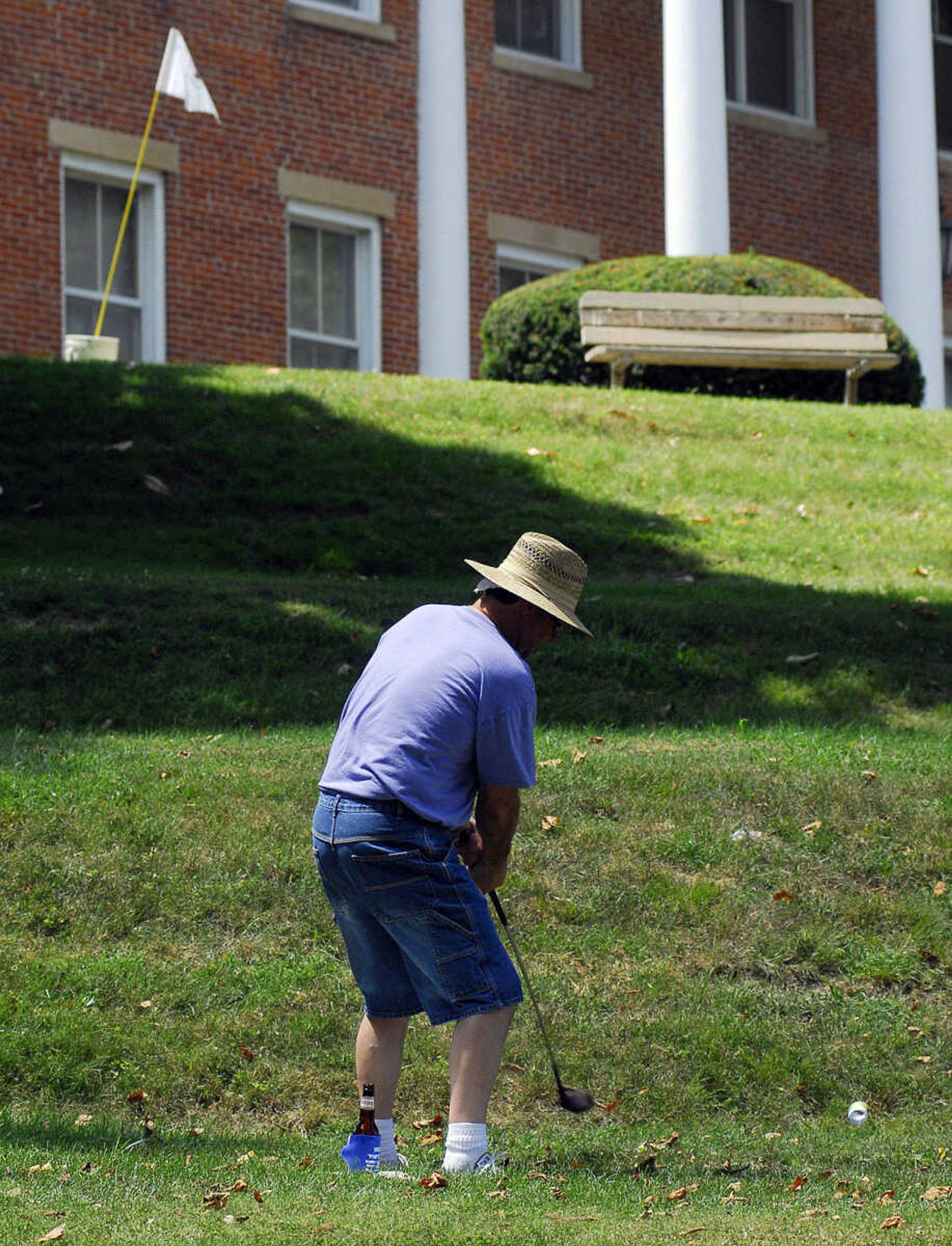 LAURA SIMON~lsimon@semissourian.com
Dave Hutson takes a hack at his BirdieBall in front of the Cape Girardeau Courthouse Sunday, June 27, 2010 during the First-Ever Fifth Annual Louis J. Lorimier World Famous Downtown Golf Tournament in Cape Girardeau.