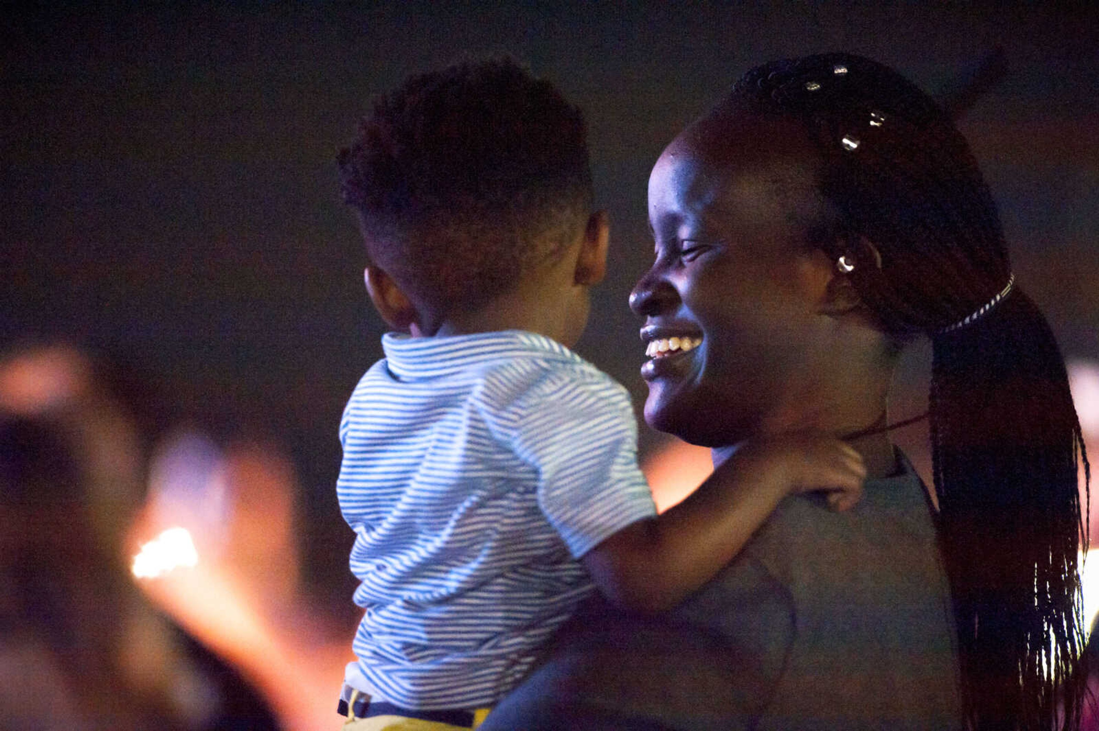 Ola Ayeni, right, and Mikai Gross, 2, sway along to a performance by Jason Crabb during the SEMO District Fair Tuesday, Sept. 10, 2019, at the Arena Park grandstand in Cape Girardeau.