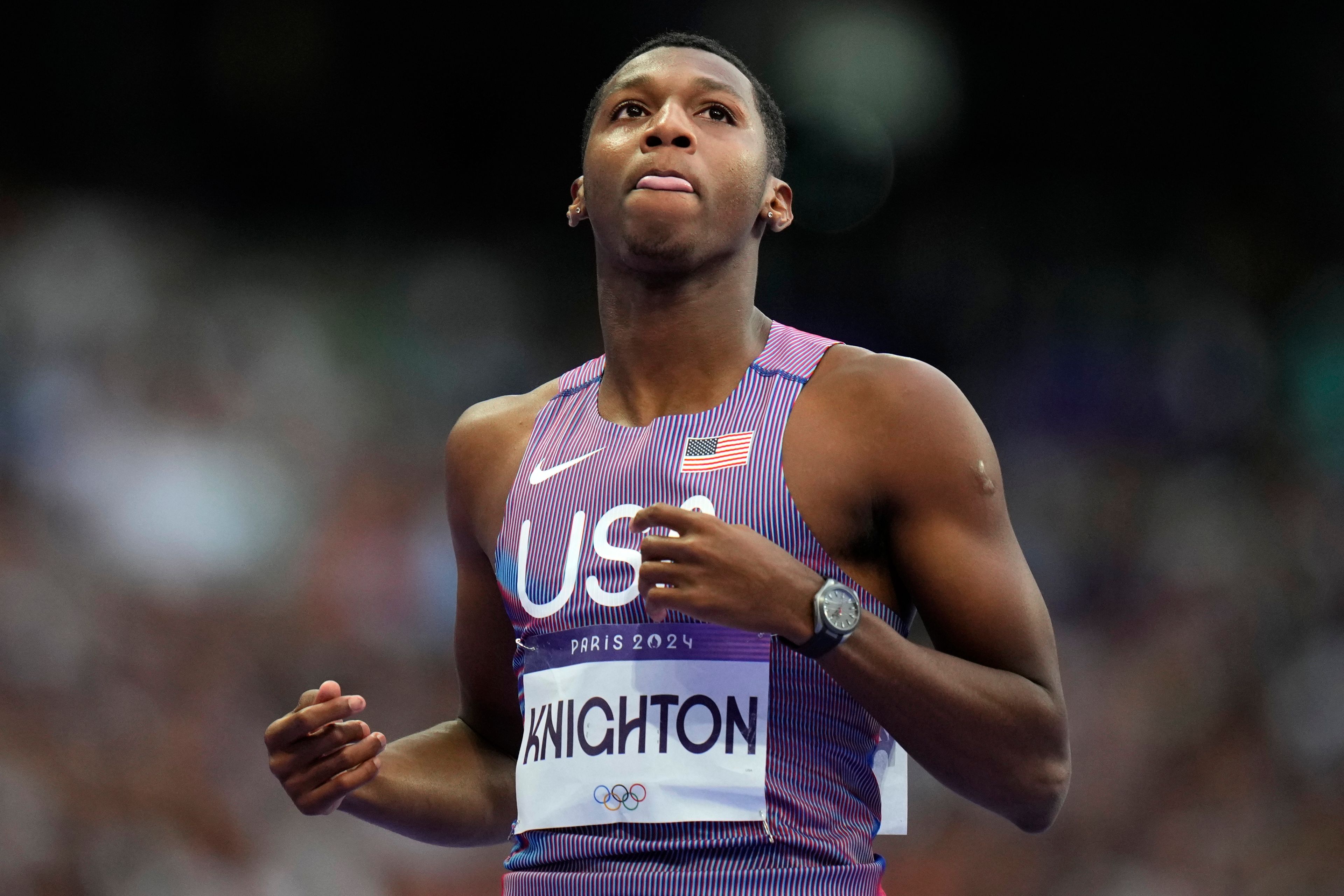 Erriyon Knighton, of the United States, reacts following his men's 200-meter semifinal at the 2024 Summer Olympics, Wednesday, Aug. 7, 2024, in Saint-Denis, France. (AP Photo/Petr David Josek)