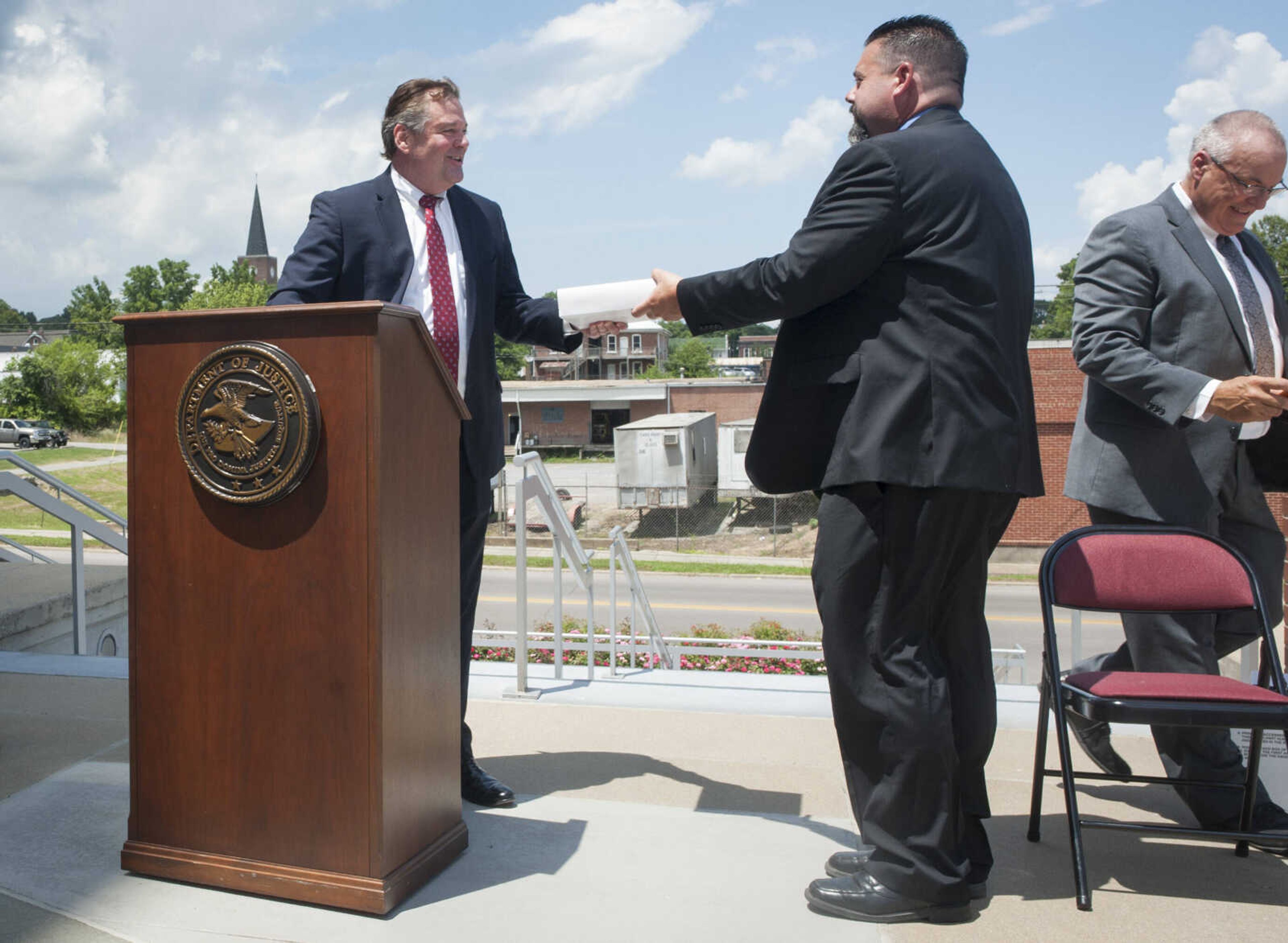 From left, U.S. Attorney Jeffrey B. Jensen recognizes SEMO Drug Task Force officer Michael Alford during a ceremony Thursday, July 9, 2020, at the Rush Hudson Limbaugh Sr. Federal Courthouse in Cape Girardeau. The ceremony was held to recognize the officers involved in a warrant arrest July 2018 in Poplar Bluff during which James Odell Johnson, Jr., opened fire and struck Alford in his bulletproof vest, SEMO Drug Task Force officer Corey Mitchell in his arm and Deputy U.S. Marshal Michael Miller in his ballistic shield.