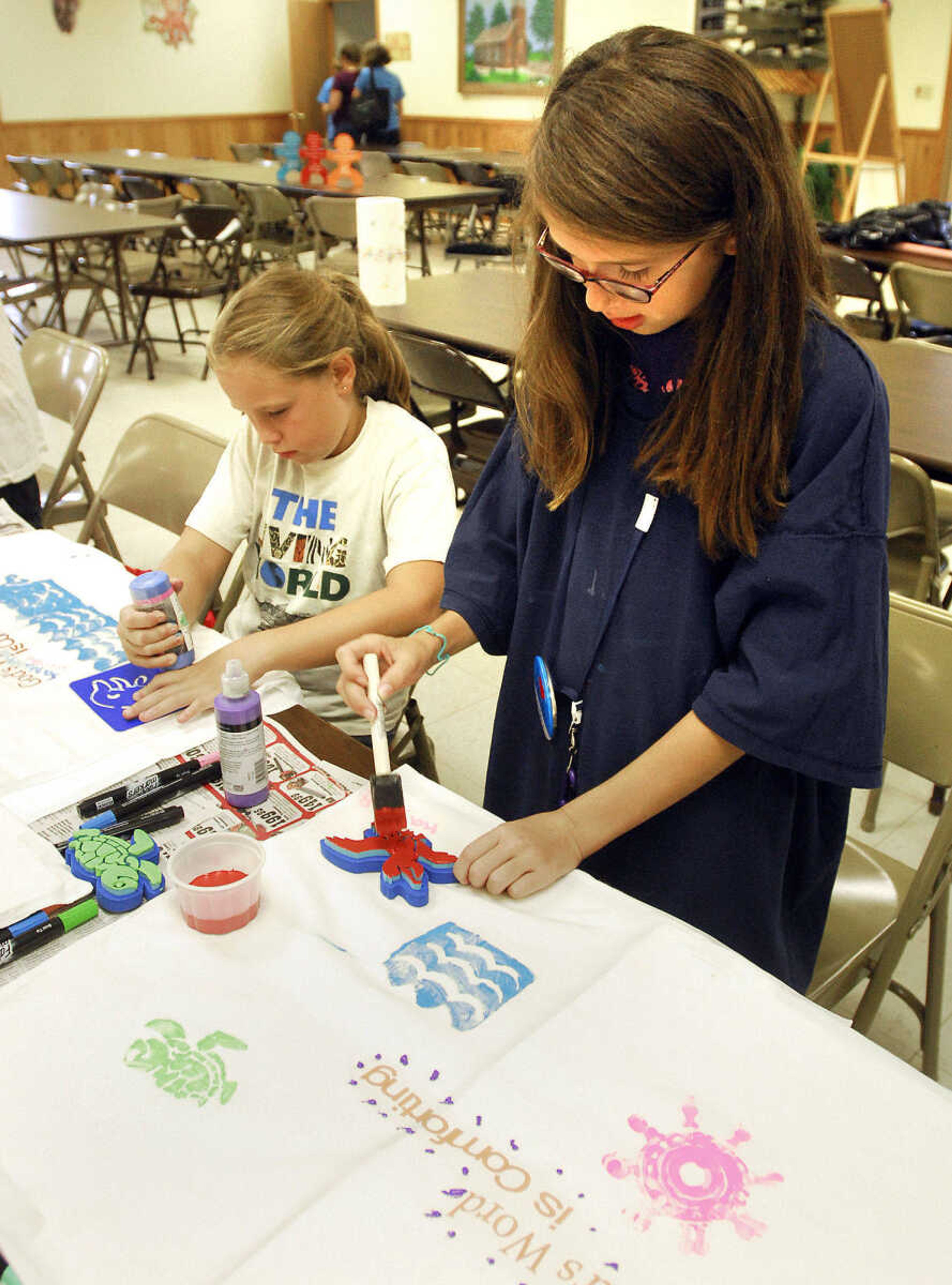 LAURA SIMON~lsimon@semissourian.com
Samantha Merritt, left, and Kayla Bedwell paint stencils to apply to their pillow cases during the arts & crafts portion of VBS at Eisleben Lutheran Church in Scott City Monday, August 2, 2010.